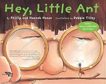 Cover of a children's book titled 'Hey, Little Elephant' featuring a person's face with large round glasses, a small elephant reflected in the glasses, and a brown background.