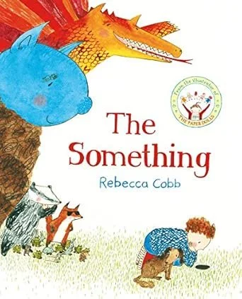 Cover of a children's book titled 'The Something' by Rebecca Cobb, featuring illustrations of a large crocodile, a blue whale, a tree, two cats, a girl, and a small dog, with playful colors and whimsical style.