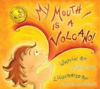 Book cover titled 'My Mouth is a Volcano!' written by Julia Cook and illustrated by Carrie Hantinans. Features an illustration of a girl with red hair and a large open mouth with swirling lines suggesting speech.