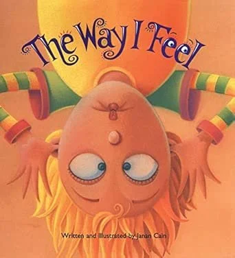 Cover of a children's book titled "The Way I Feel" featuring a cartoon girl with orange hair, lying upside down with a playful expression, and the author's name Janan Cain.