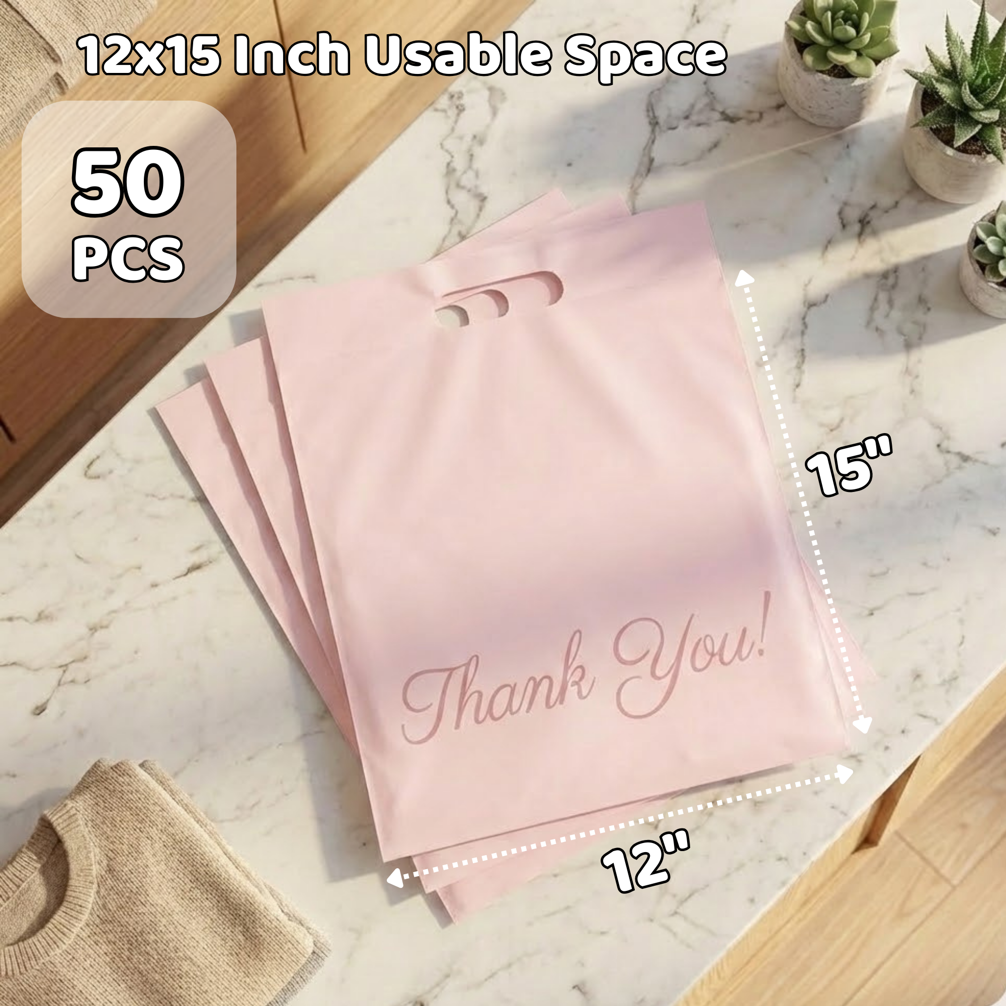 A set of five pink thank you gift bags with handles on a marble countertop, accompanied by a small folded beige cloth, with a background of small potted succulents and a wooden surface.