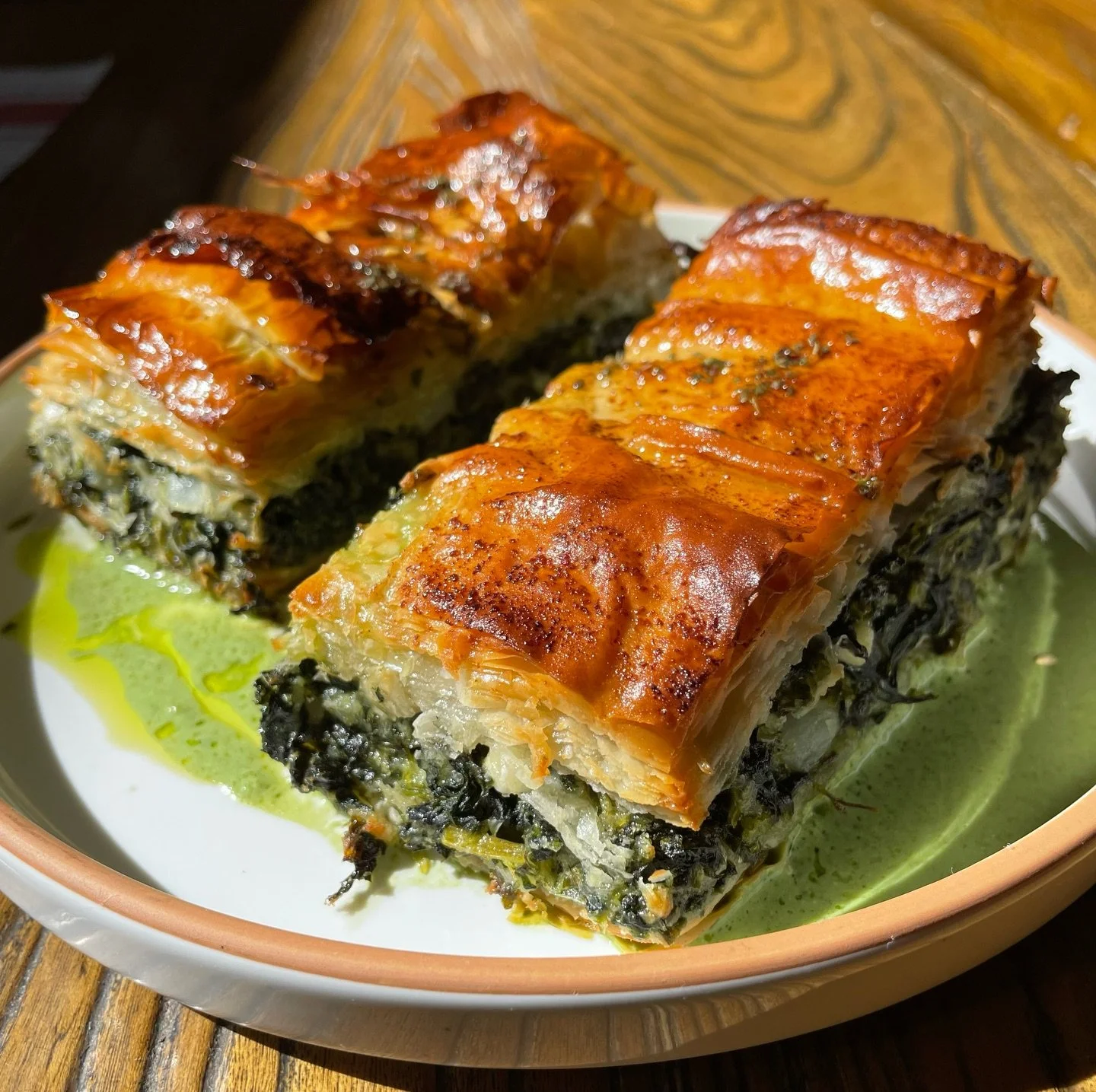 Spanakopita at Stina. 🇬🇷
Layers of crisp phyllo filled with fresh spinach, barrel-aged sheep&rsquo;s milk feta, shallots, lemon zest, dill, parsley, and cracked black pepper &mdash; made fresh in-house with care and technique that&rsquo;s been pass