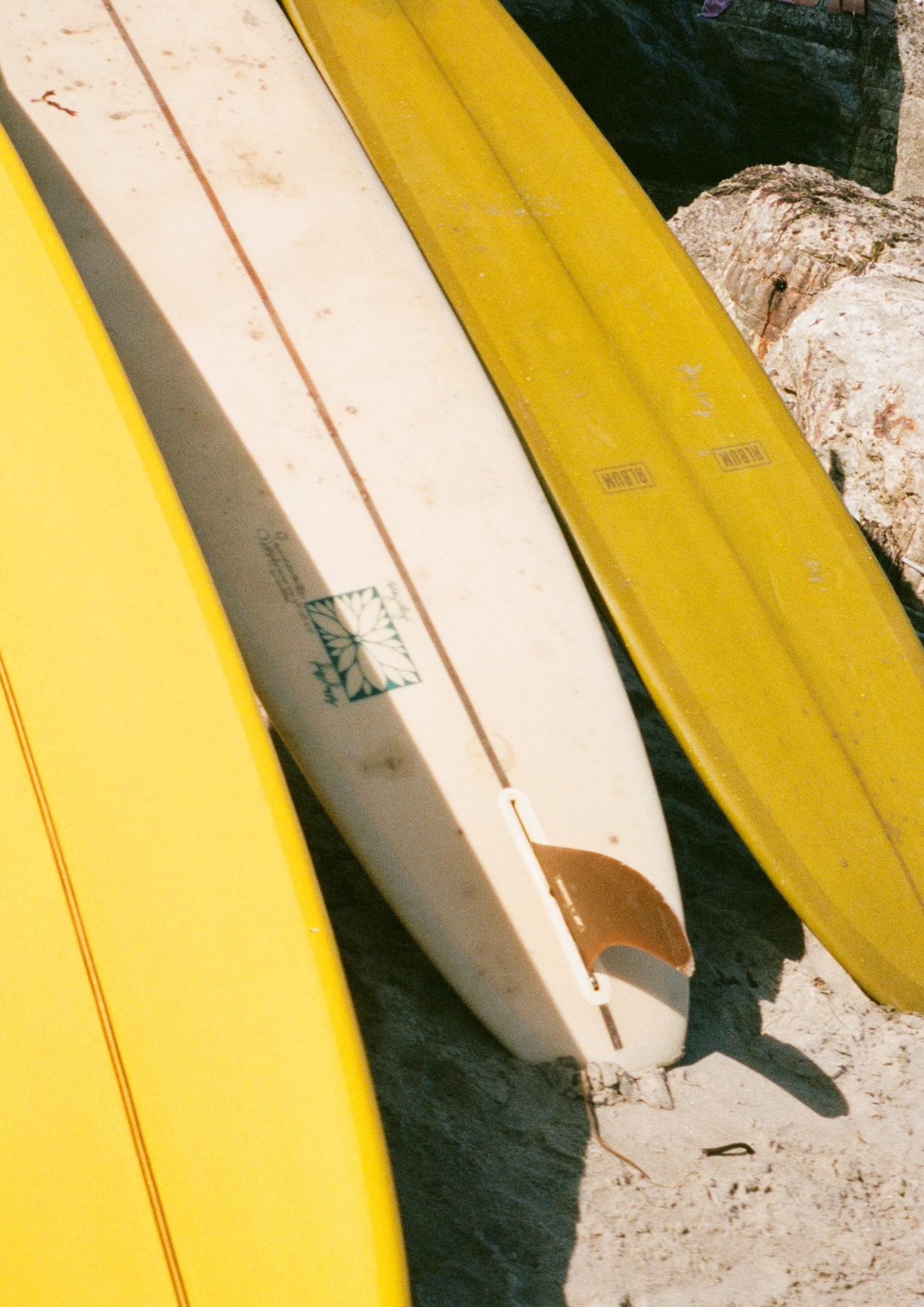 A dock with yellow boats, one of which has the logo and text that reads 'Blown'.