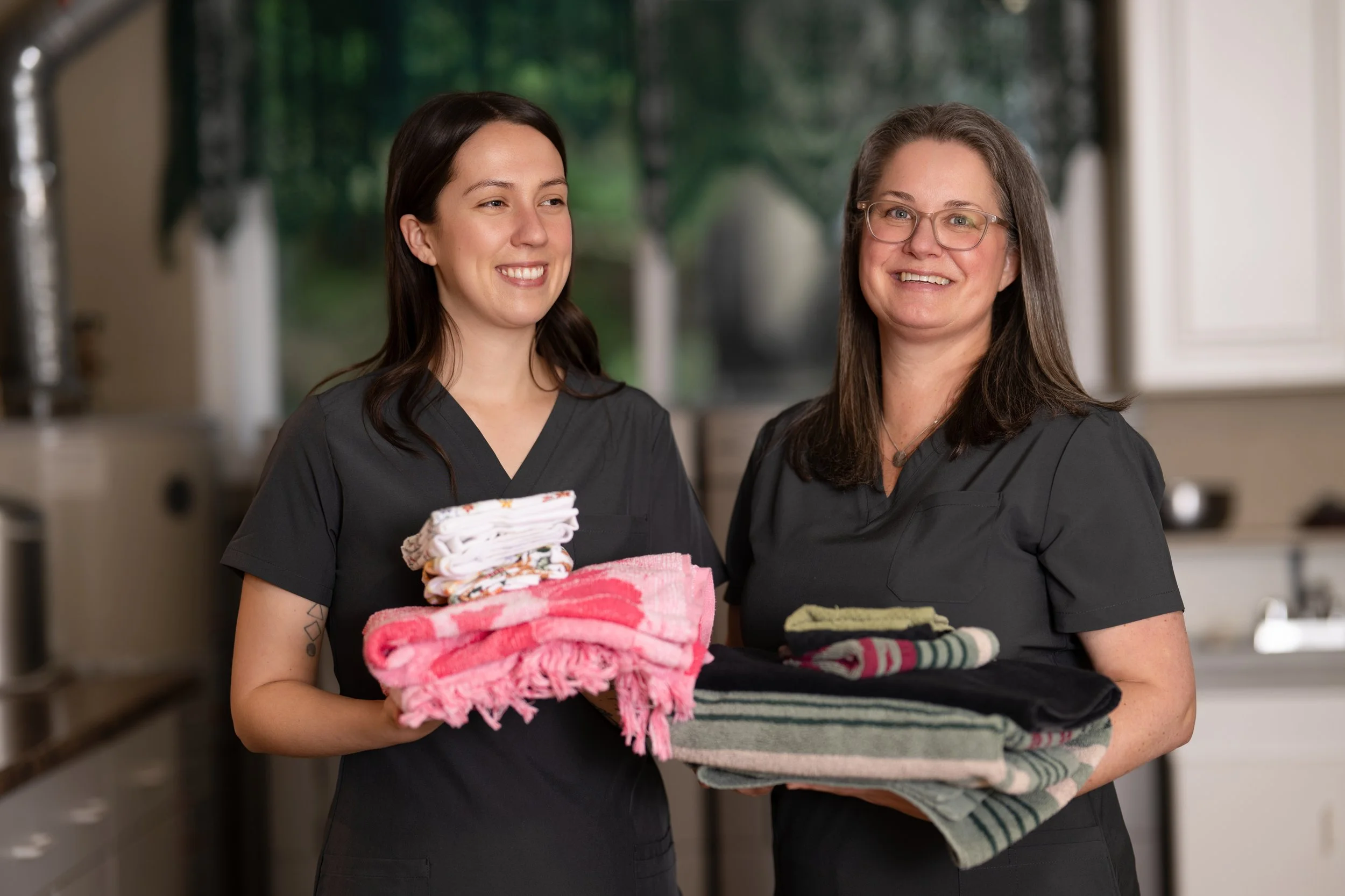 island Nursing team assisting with laundry.