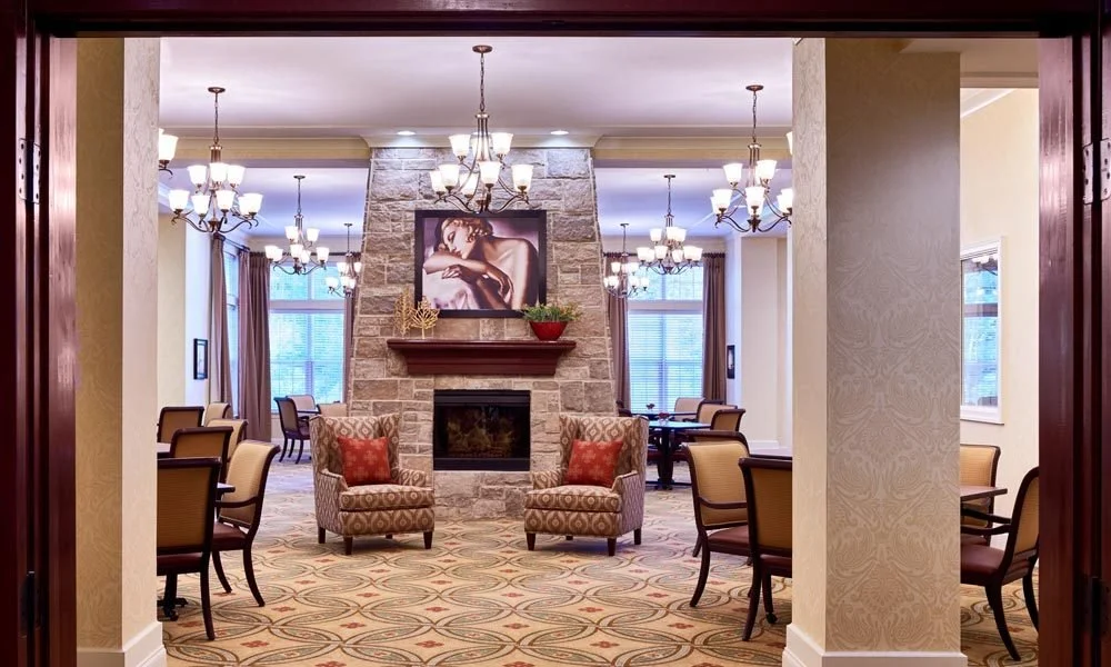 Sophisticated senior living interior design for Waltonwood Cotswold in Charlotte. We specialize in creating high-end, hospitality-grade environments that prioritize comfort, safety, and timeless style.