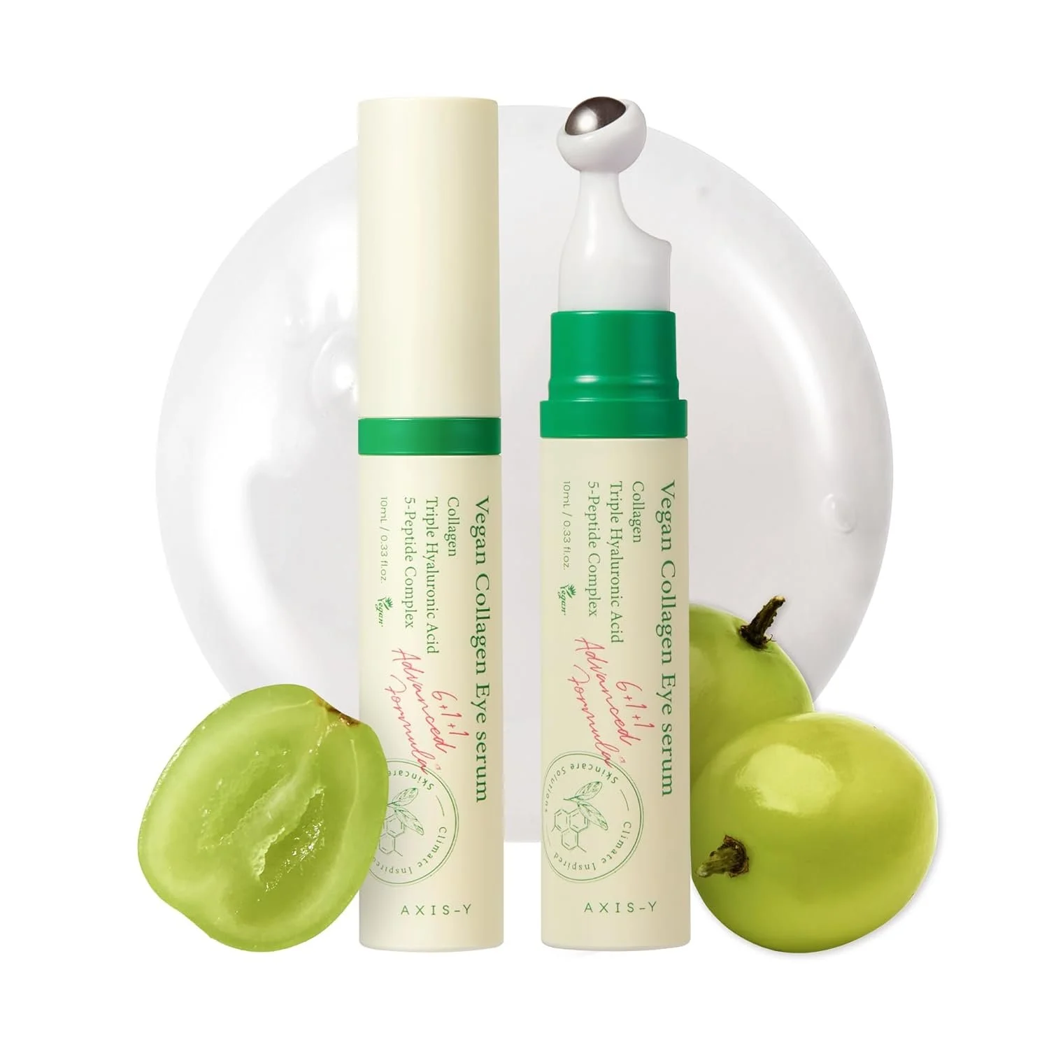 Two tubes of vegan collagen eye serum on a clear plate, with a halved green grape and a whole green grape beside them.