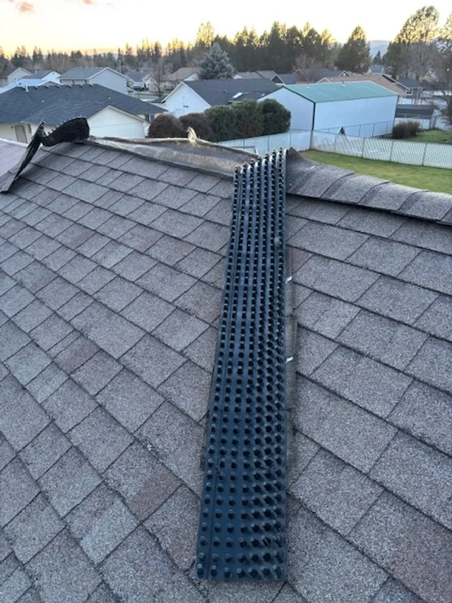Roof ventilation detail installed on an asphalt shingle roof by Willenborg Roofing in North Idaho.