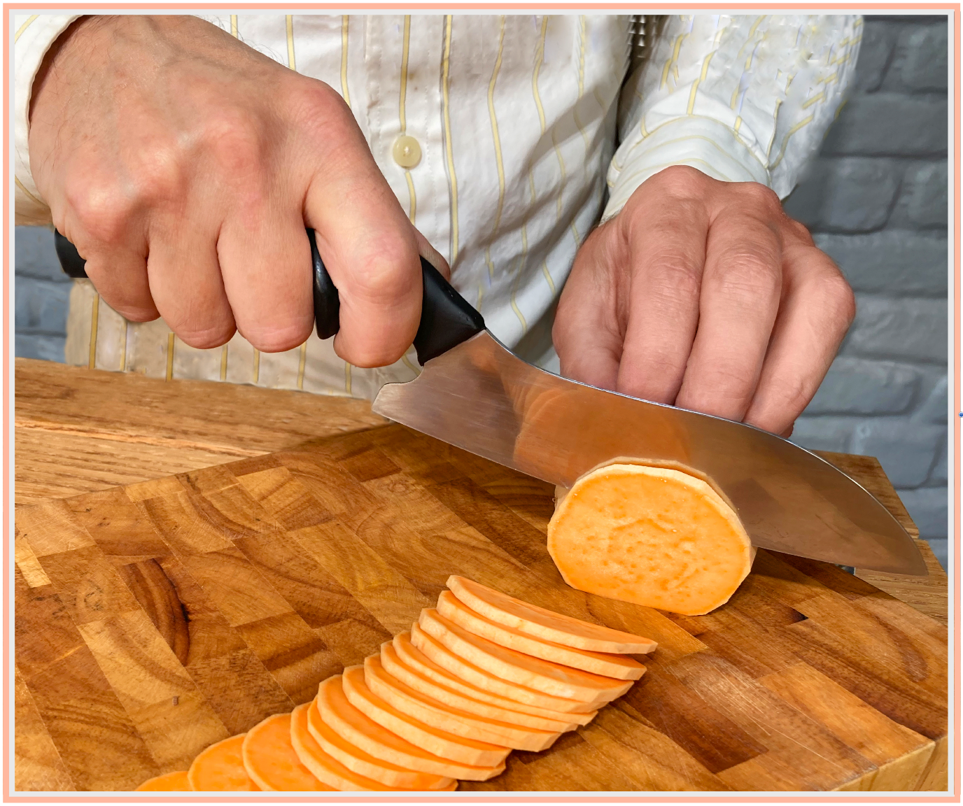 DBx Knives custom fitted chef knife in use — ergonomic hand-optimized handle showing natural grip position during food preparation. Sized-to-fit design eliminates hand fatigue, numbness and pain during extended cutting tasks. Made in the USA.