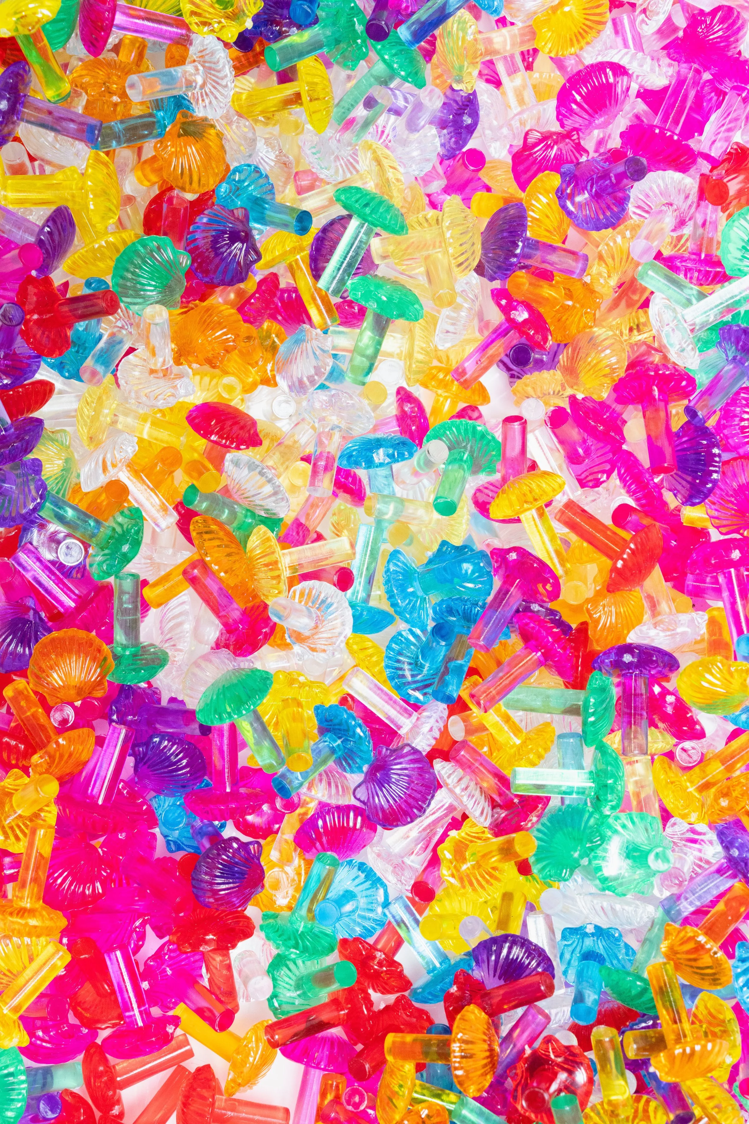 A colorful assortment of plastic cacti in various bright colors.