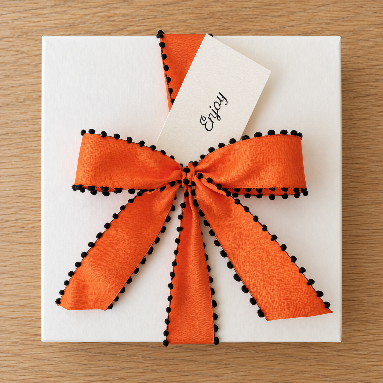 Ivory Gift Box with Orange Ribbon.png