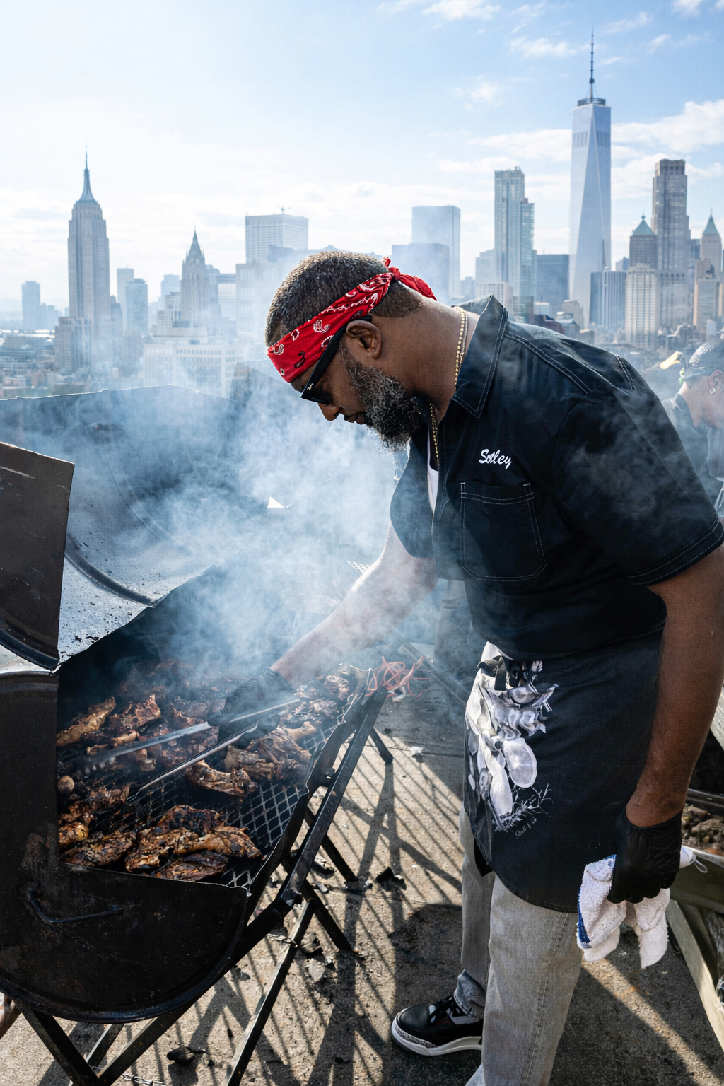 Chef Scotley cooking with a grill on a rooftop overlooking the NYC skyline