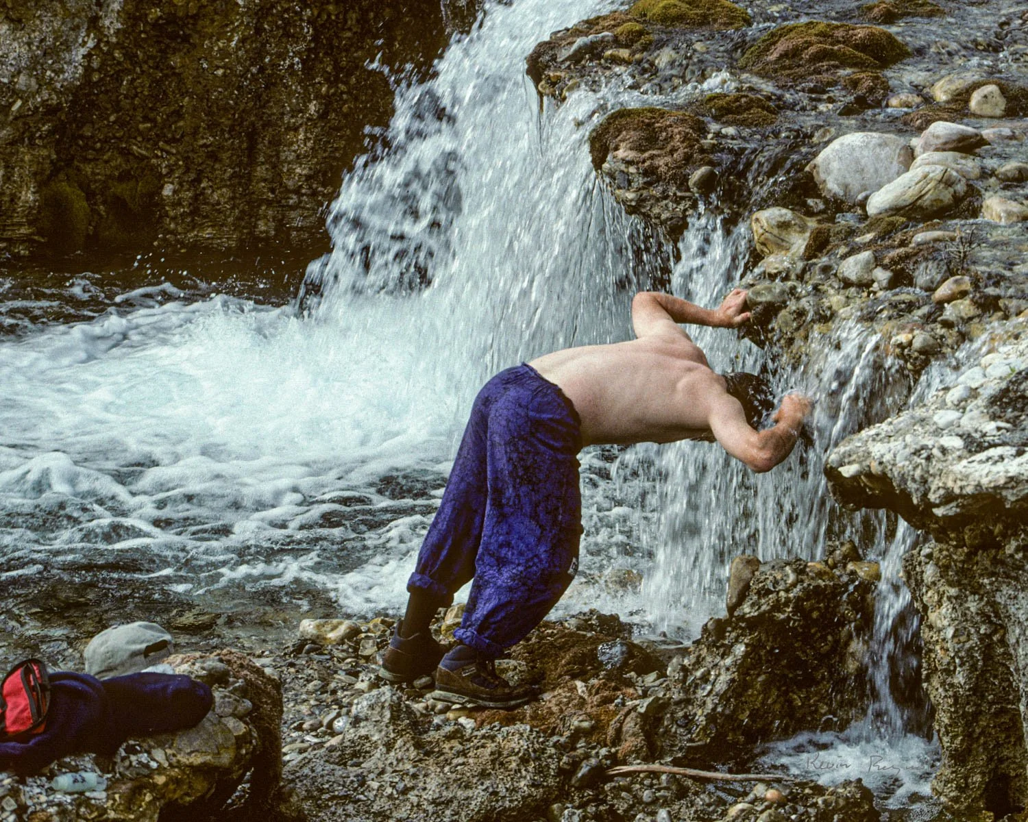 Washing hair in a small falls along the Mountain River