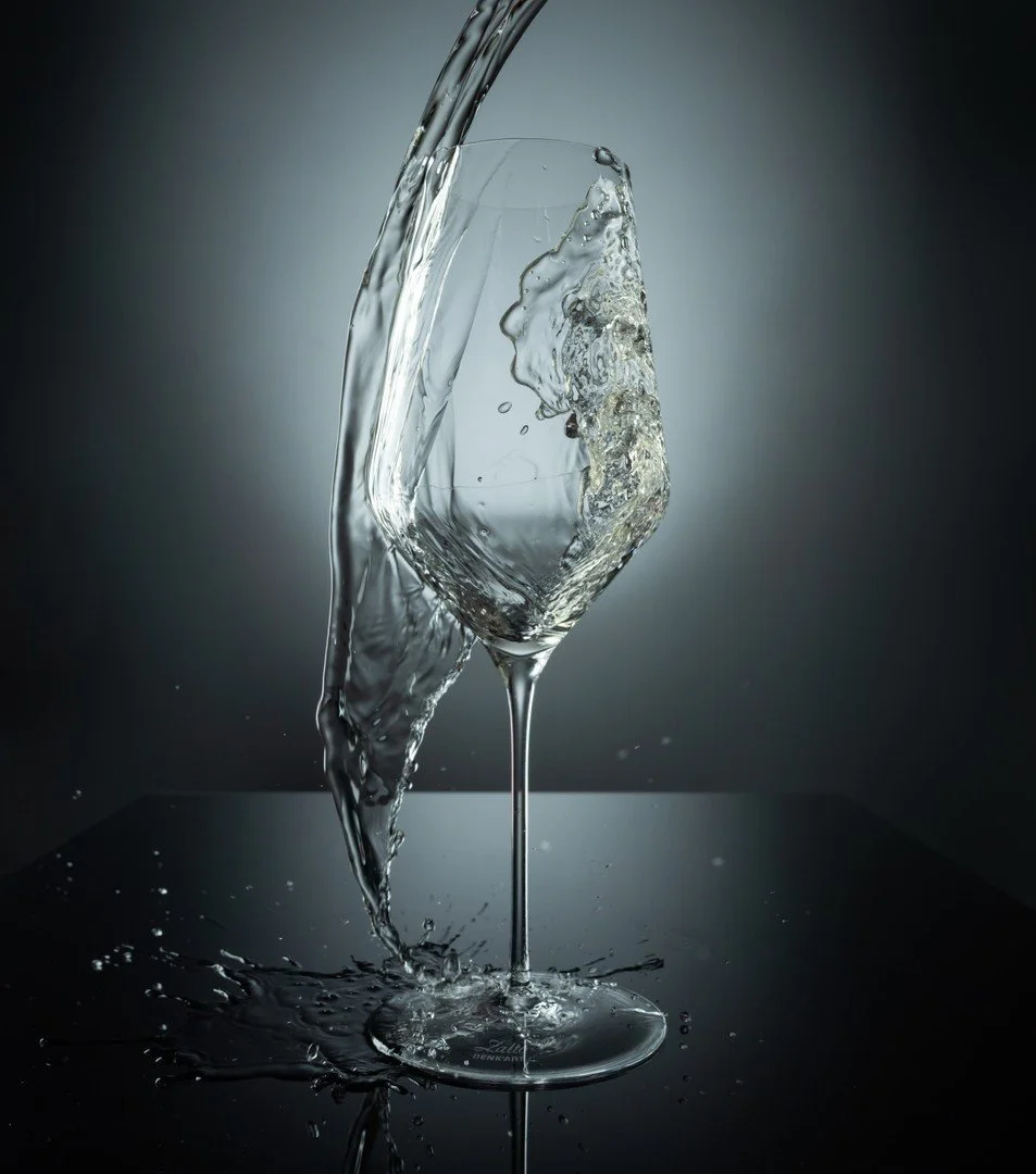 sparkling wine splashing into glass