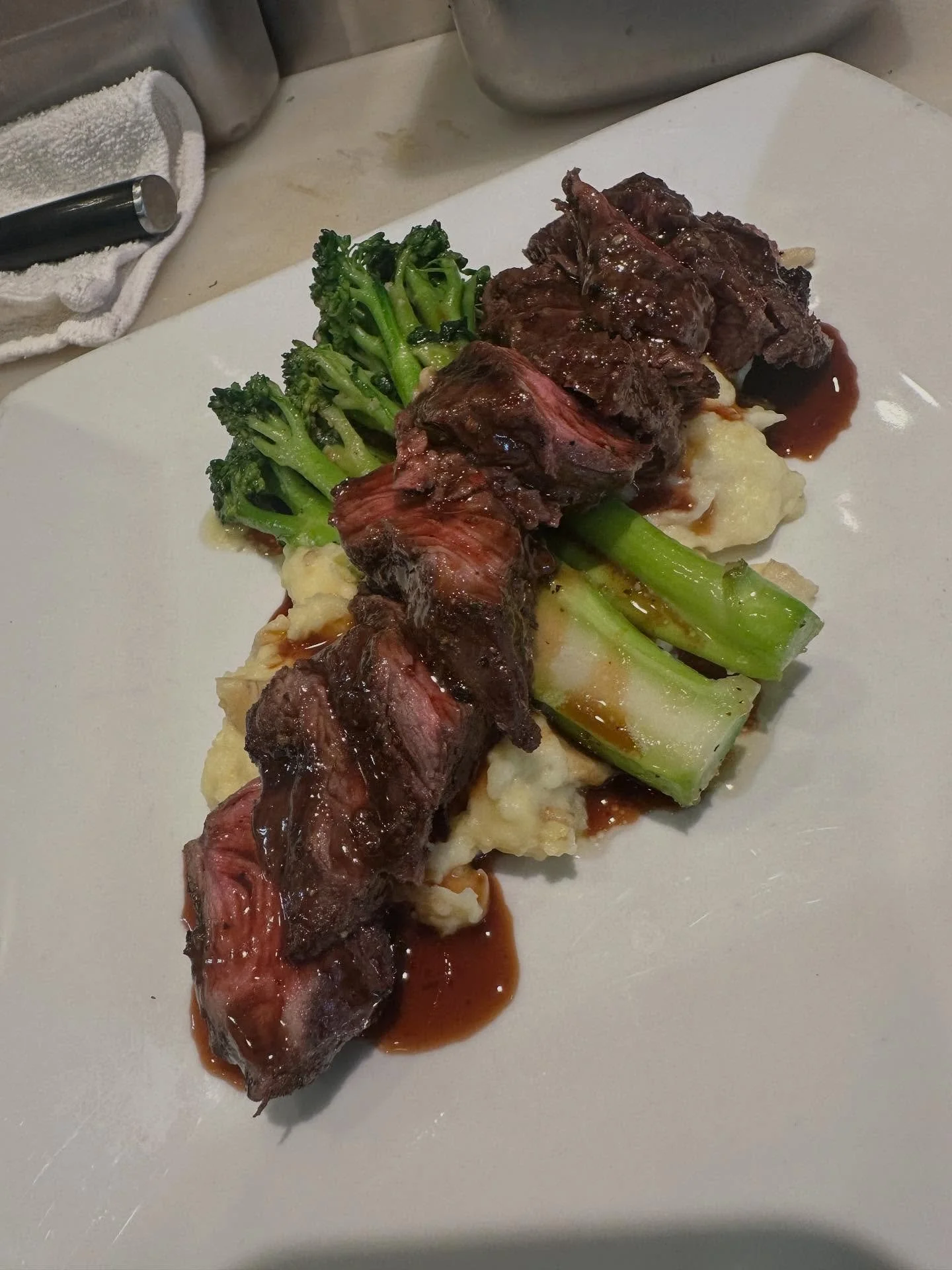 Bistro Steak. Grilled hanger steak with Yukon gold mashed potatoes, saut&eacute;ed broccolini and a red wine demi glac&eacute;.