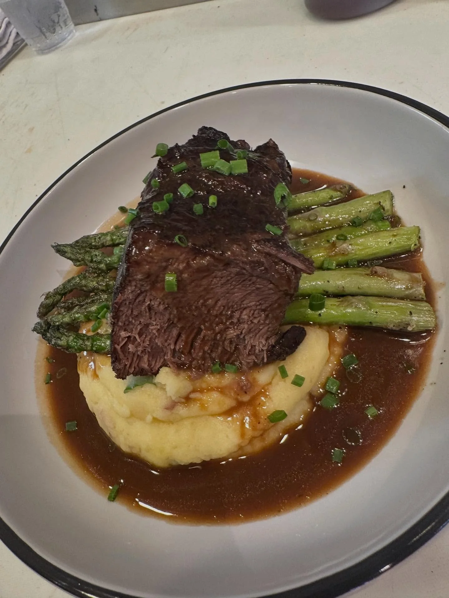 Braised Boneless short ribs with loaded mashed potatoes and grilled asparagus. $28