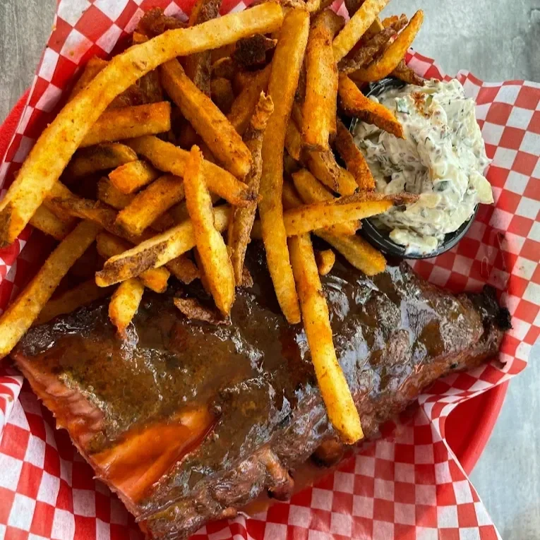 Photo of mouthwatering ribs and perfectly seasoned fries