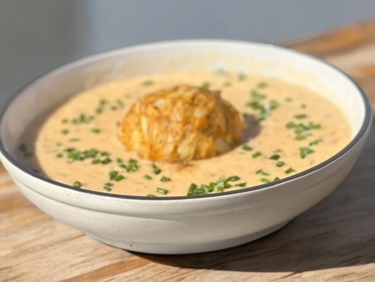 Photo of no-fill crab cake swimming in bowl of delicious cream of crab soup