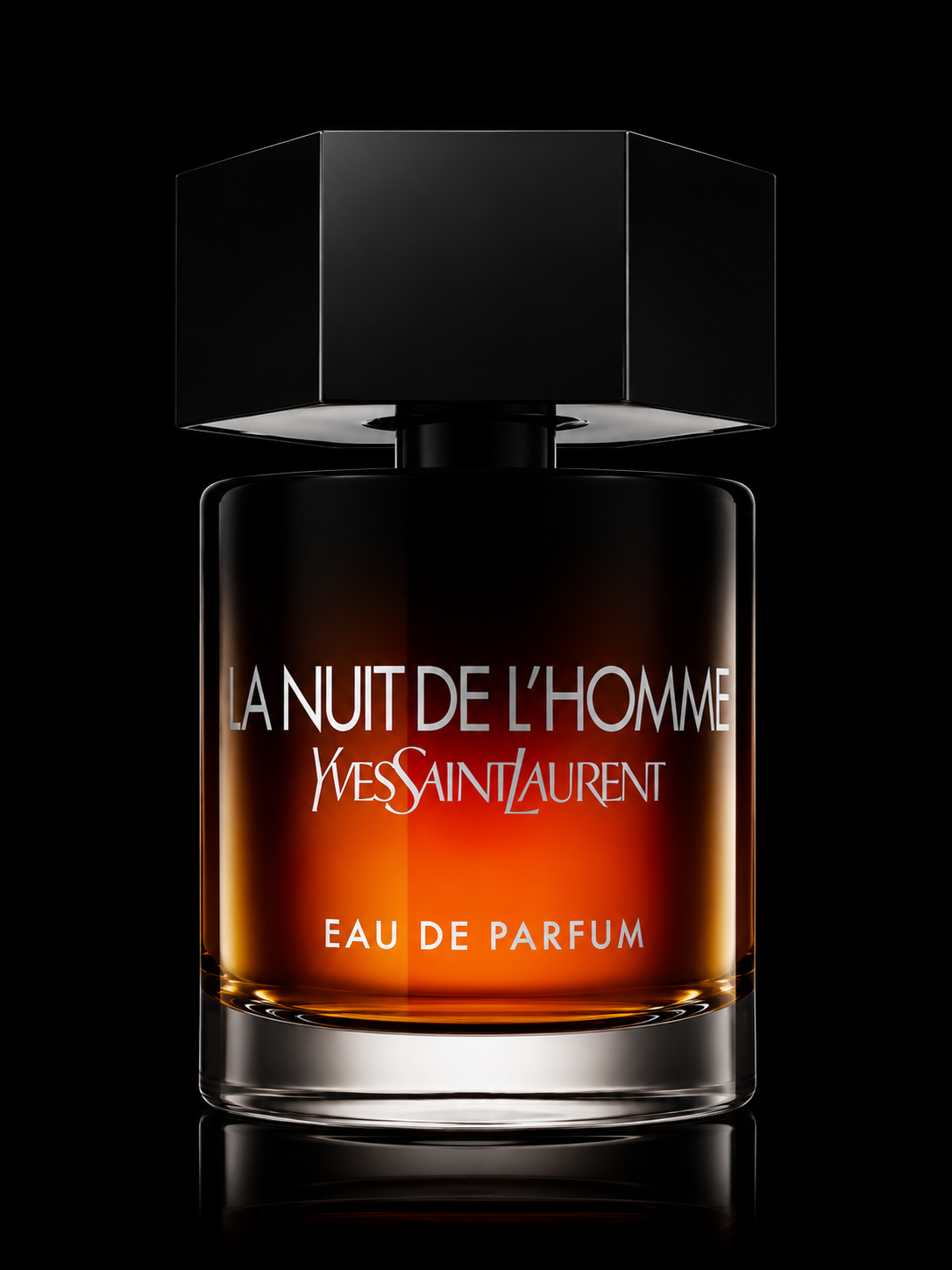 Flacon de parfum Yves Saint Laurent 'La Nuit de L'Homme' avec un design noir et un liquide ambré visible à travers le verre, présenté sur un fond noir.