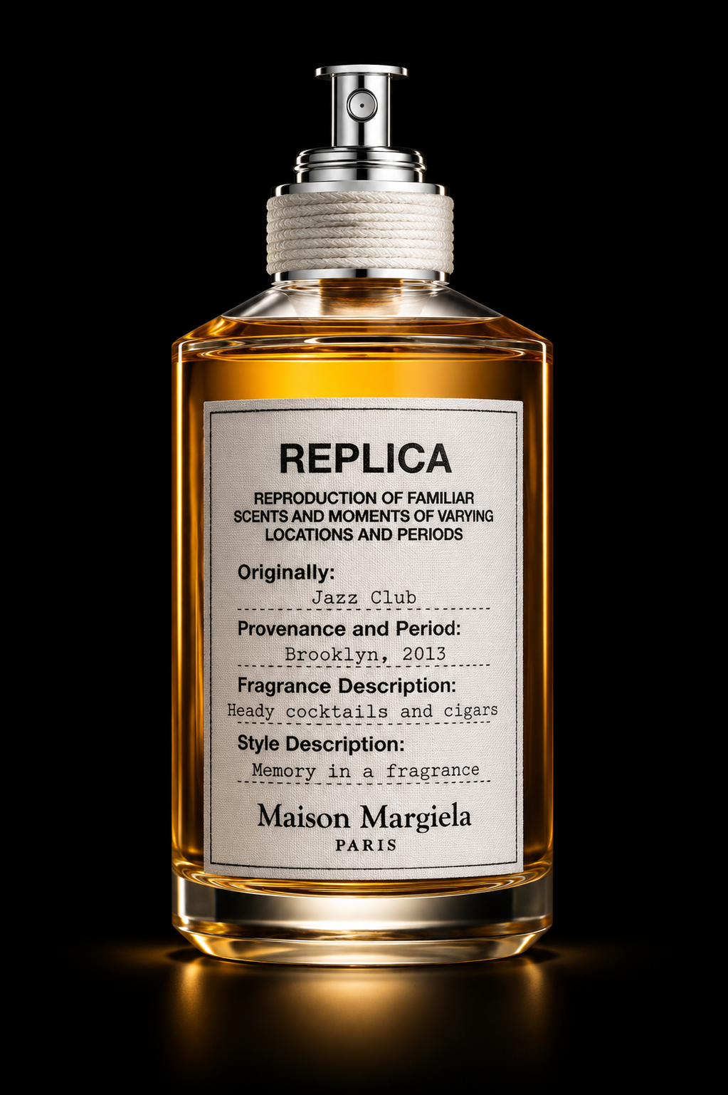 Une bouteille de parfum transparente avec un liquide doré, étiquetée 'REPLICA', avec un bouchon métallique et une étiquette blanche contenant des descriptions en français et en anglais, contre un fond noir.