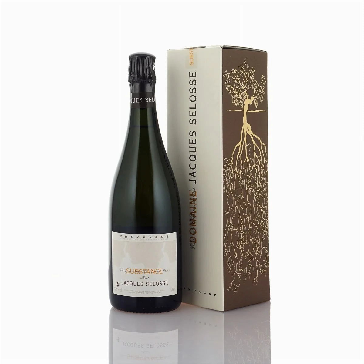 Bouteille de champagne Jacques Selosse avec une boîte élégante à côté, décorée d'une illustration d'un arbre avec ses racines détaillées.
