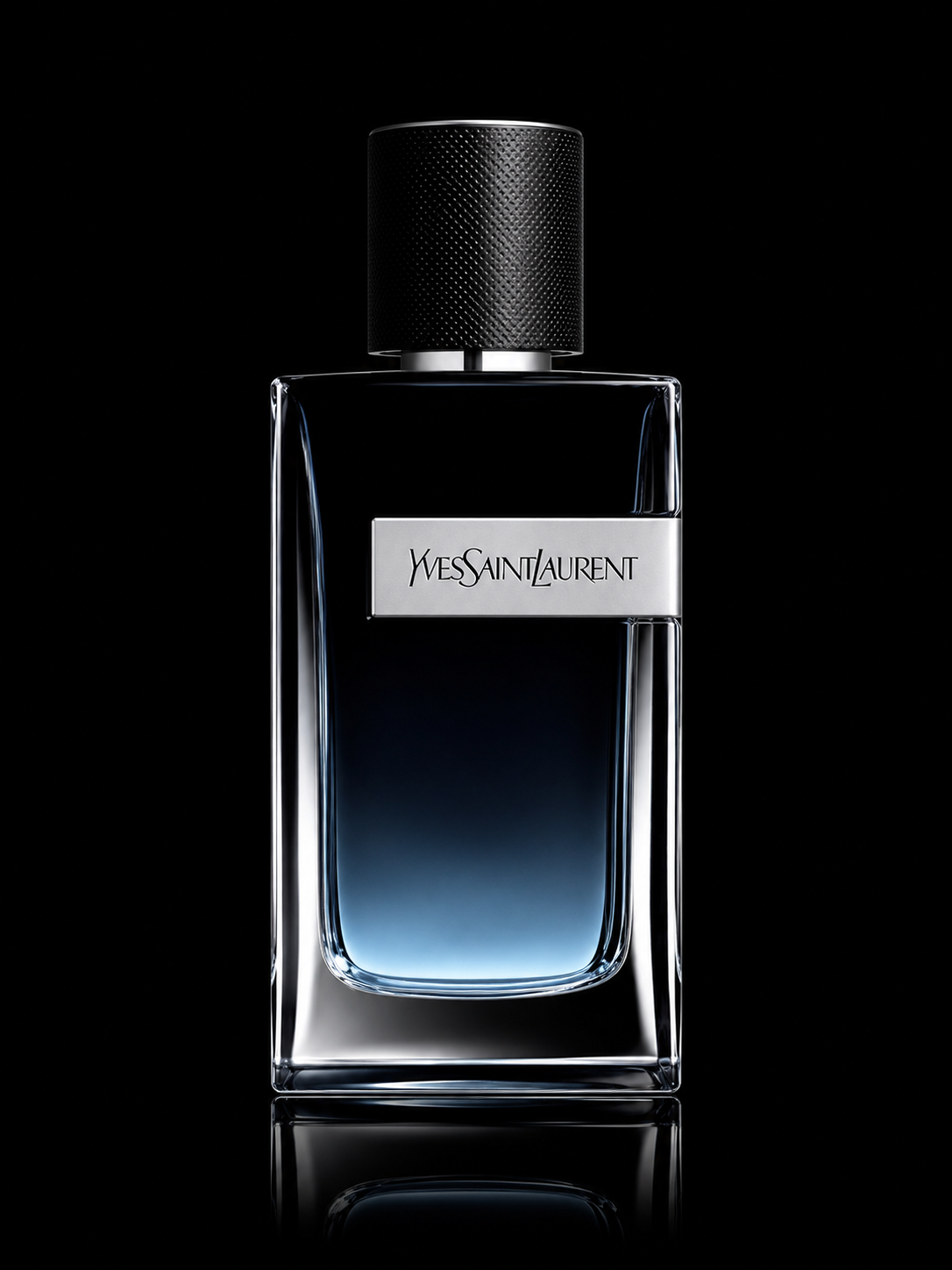 Une bouteille de parfum Yves Saint Laurent avec un design élégant et moderne, planter sur un fond noir avec un reflet en dessous.