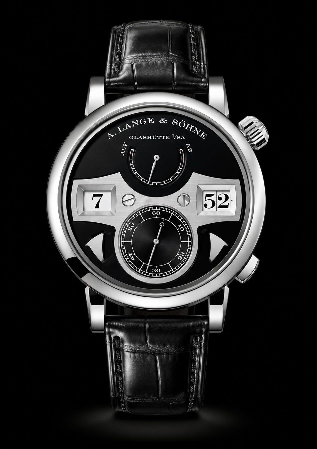 Montre de luxe noire et argentée avec un affichage numérique des heures, un indicateur de réserve de marche, et un sous-compteur pour les secondes, avec un bracelet en cuir noir.