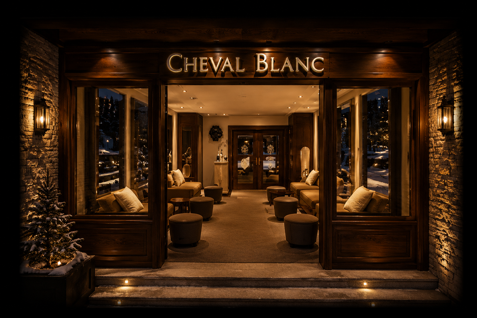 Entrée chaleureuse d'un salon avec tables et canapés en cuir, décoré de lumières douces et d'une ambiance cosy.