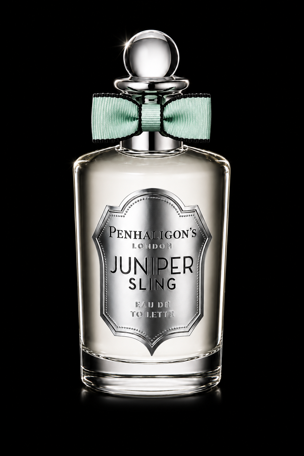 Flacon de parfum en verre avec un nœud en ruban vert pale autour du cou, fond noir.