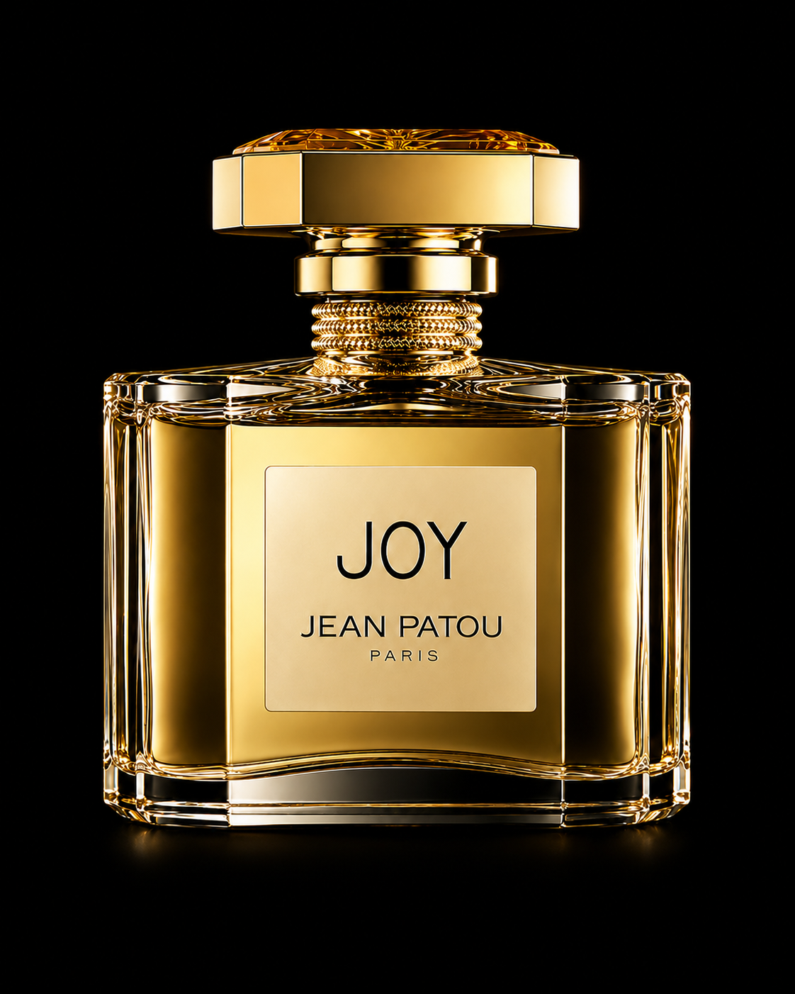 Flacon de parfum doré intitulé 'Joy' de Jean Patou, Paris, avec un design élégant et luxueux, sur fond noir.
