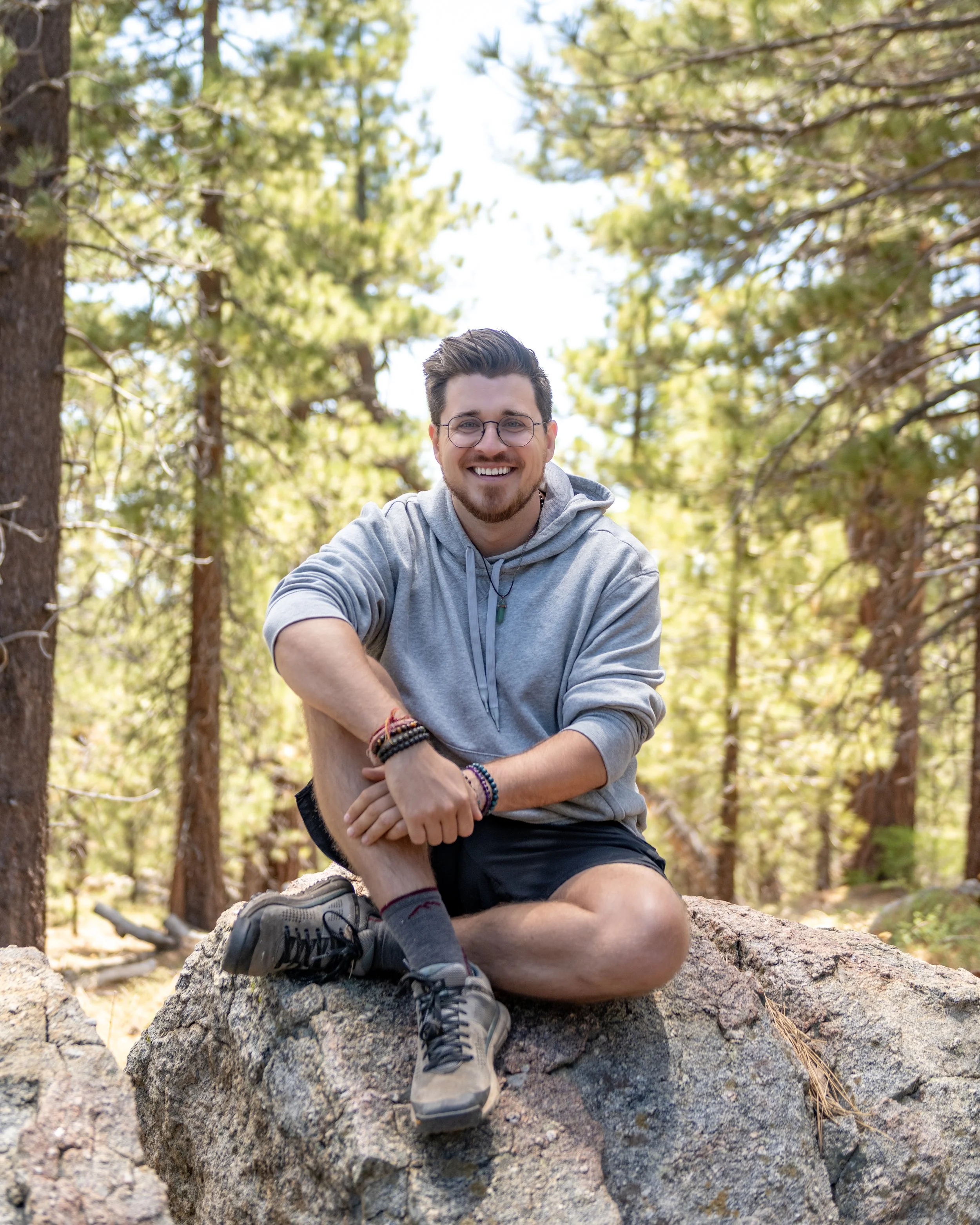 Drew Wiggins, depth coach and founder of Wayfinding Collective, in the forest outside Bakersfield, California
