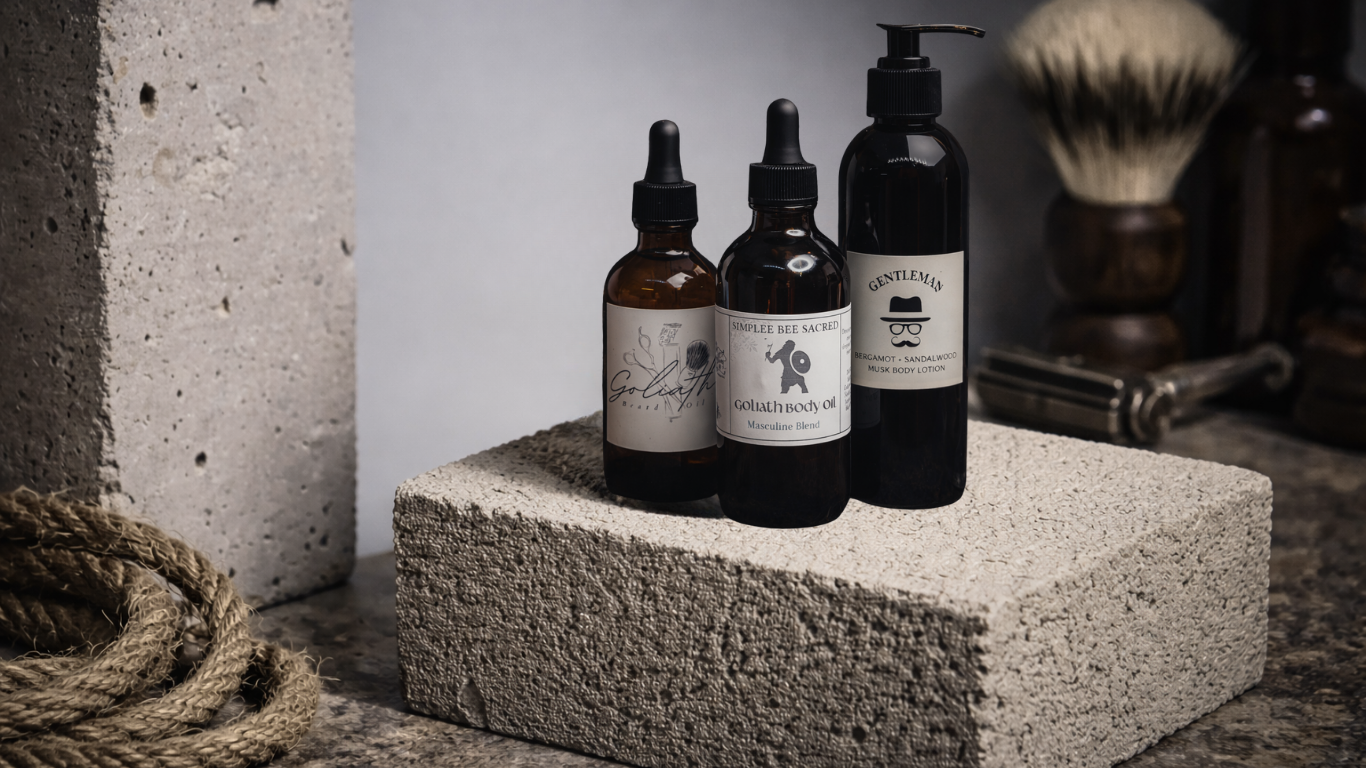 Three dark-colored bottles of grooming products on a textured stone block, with a shaving brush and grooming tools in the background.