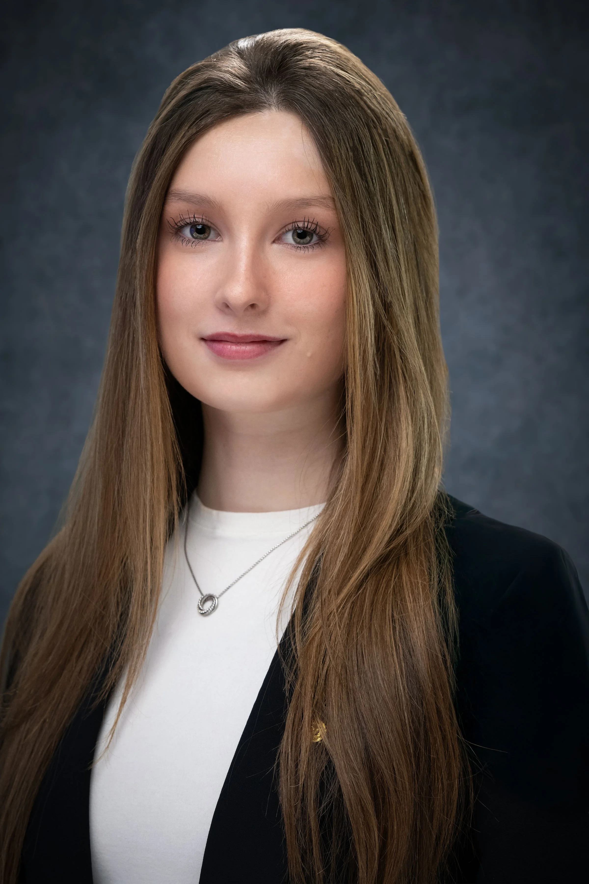 Corporate portrait showcasing attention to detail, refined wardrobe styling, and professional presentation.