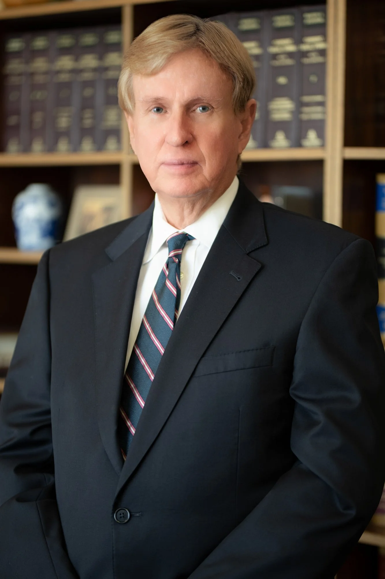 Professional headshot showcasing a confident business professional with a welcoming expression.