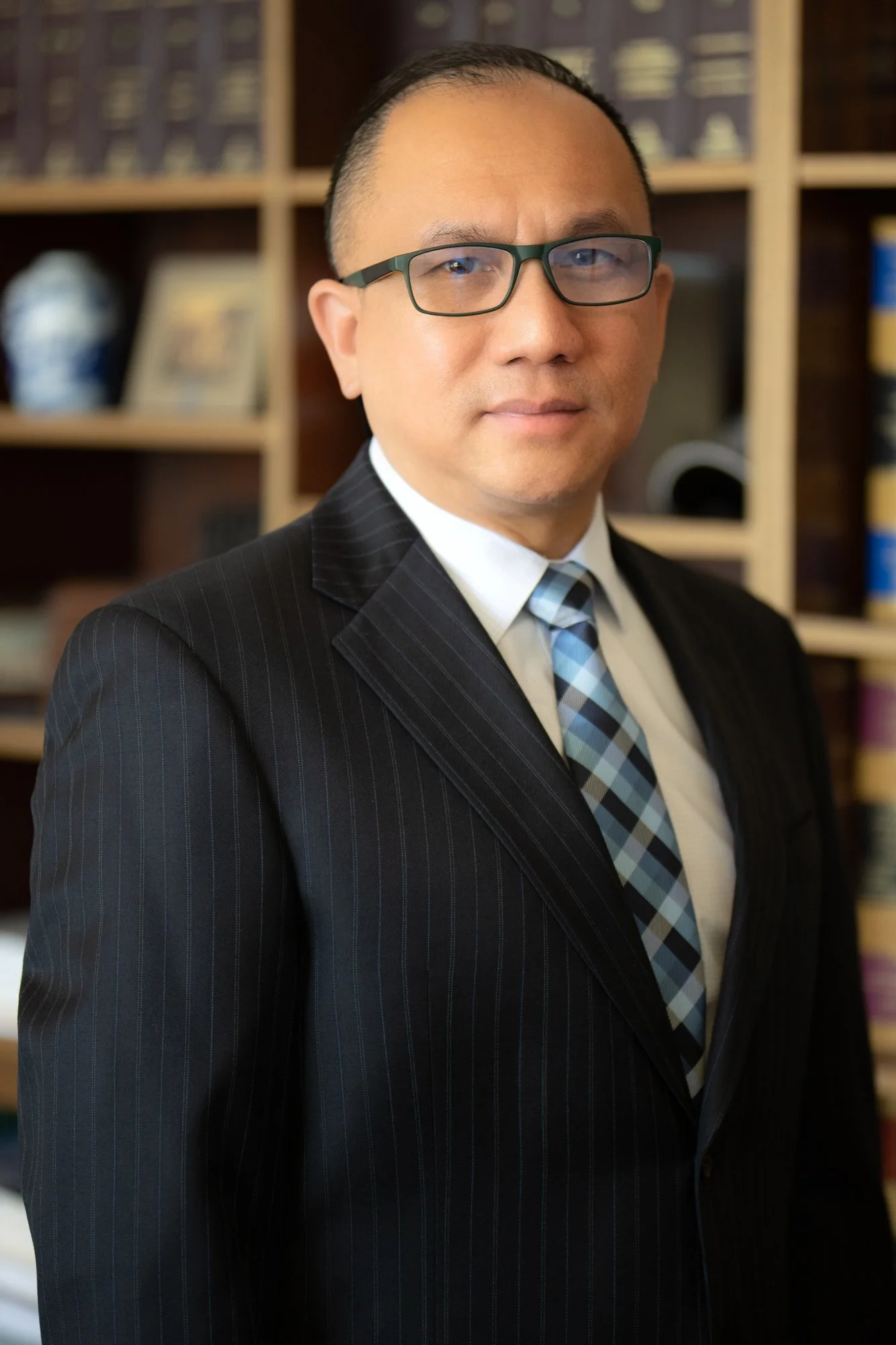 Corporate portrait emphasizing credibility and professionalism through clean lighting and refined styling.