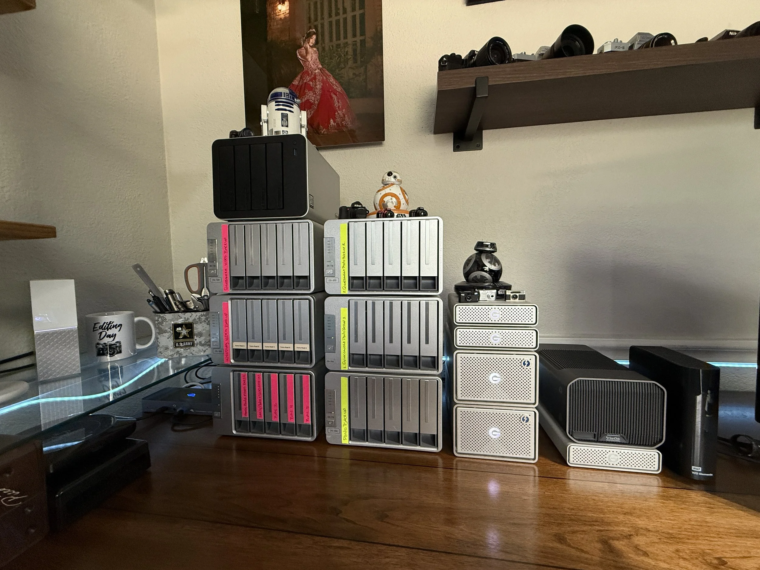 Professional photography archive storage system with multiple RAID arrays and backup hard drives used by Hector Torres Photography to preserve wedding and Quinceañera photos and videos for long-term client protection.