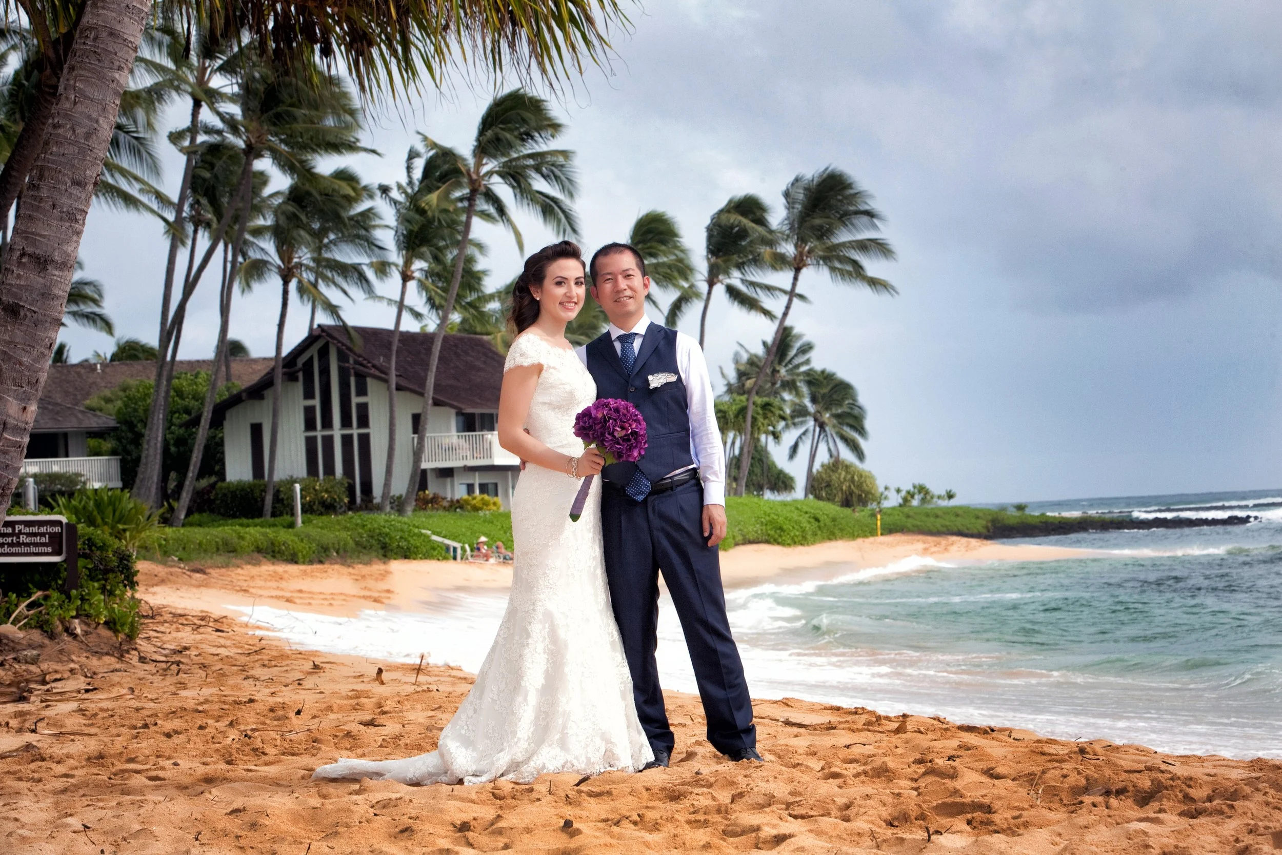 Stunning destination wedding photography in Kauai, Hawaii, featuring a bride and groom on the beach, captured by Jeremiah Andrews San Antonio Texas premier wedding photographer
