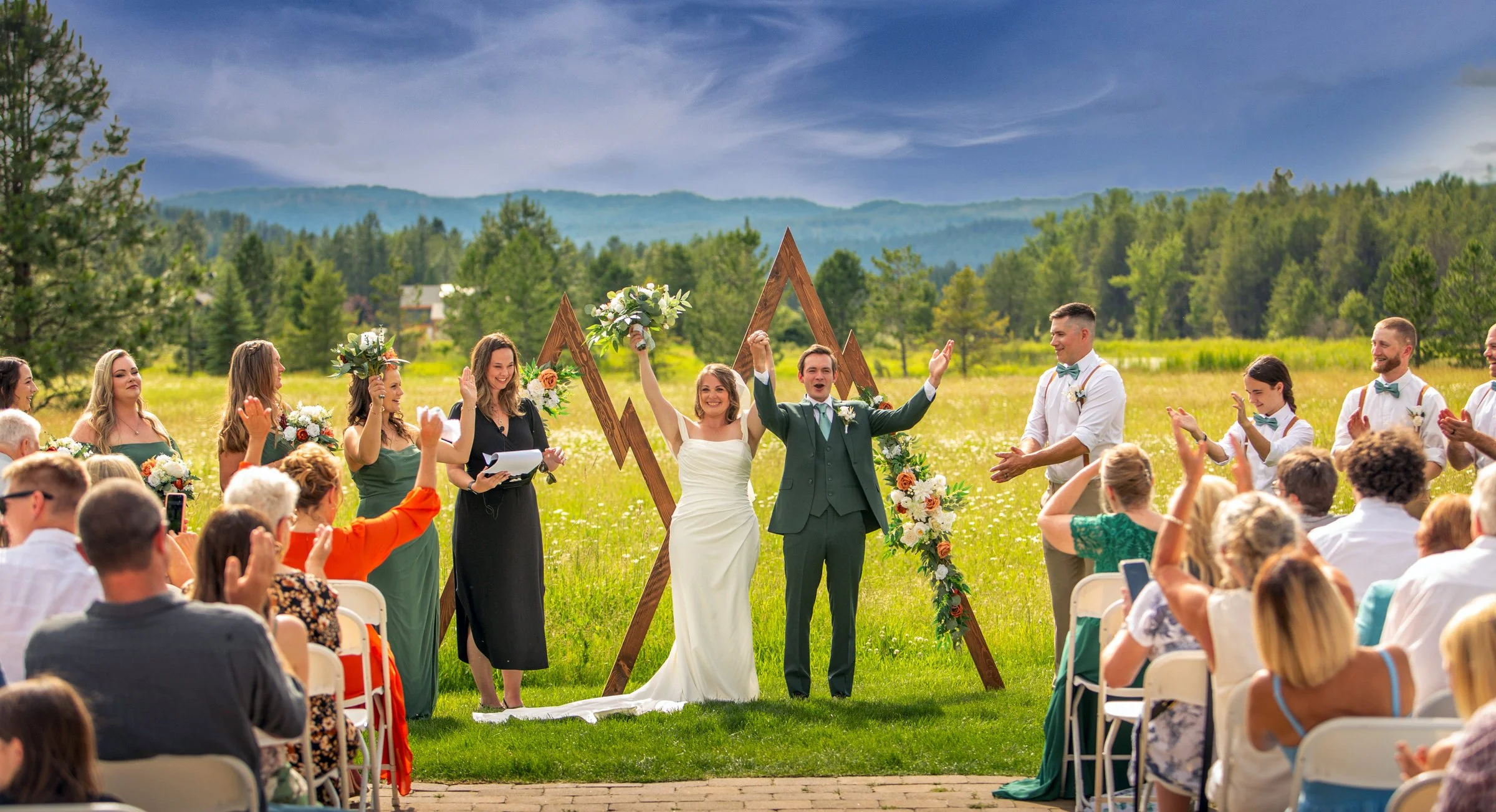 A bride and groom celebrating at the altar immediately after being pronounced husband and wife, captured by Jeremiah Andrews, San Antonio Texas premier wedding photographer