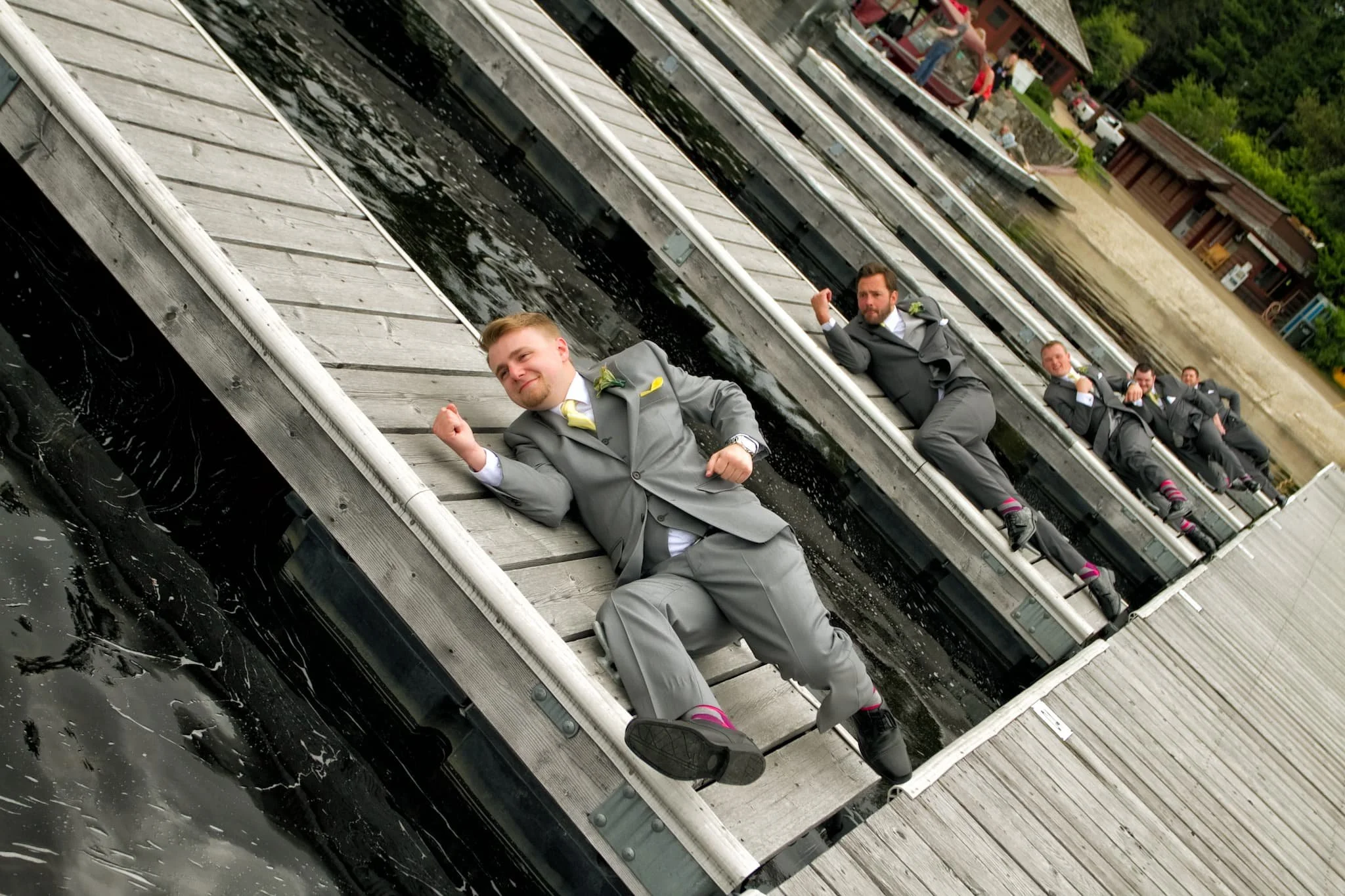 Groomsmen sharing some artistic posing during wedding day preparations, captured with natural light and an editorial approach common to modern San Antonio weddings.