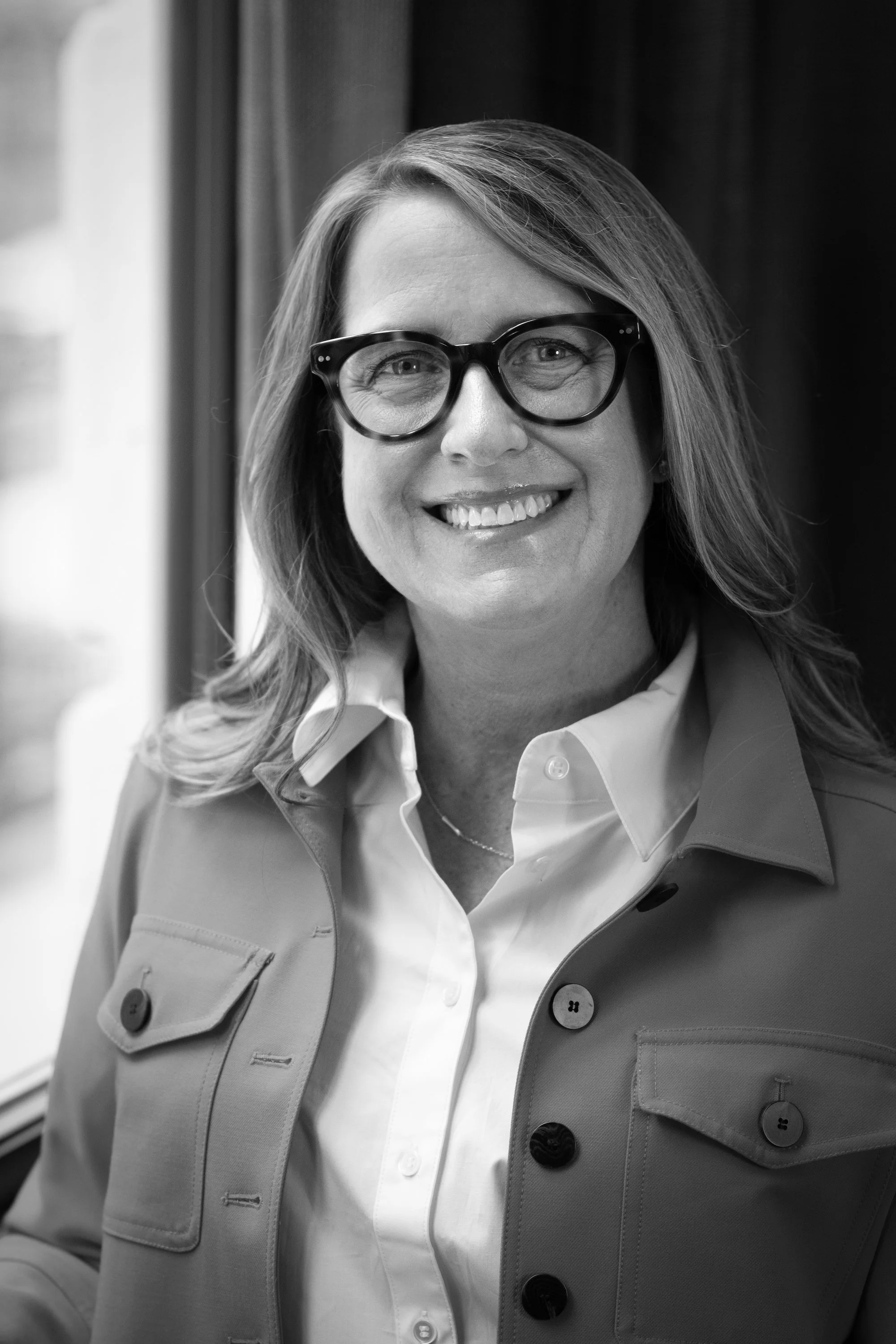 A black and white portrait of Teri Evans, Leadership Facilitator at EVP Leadership