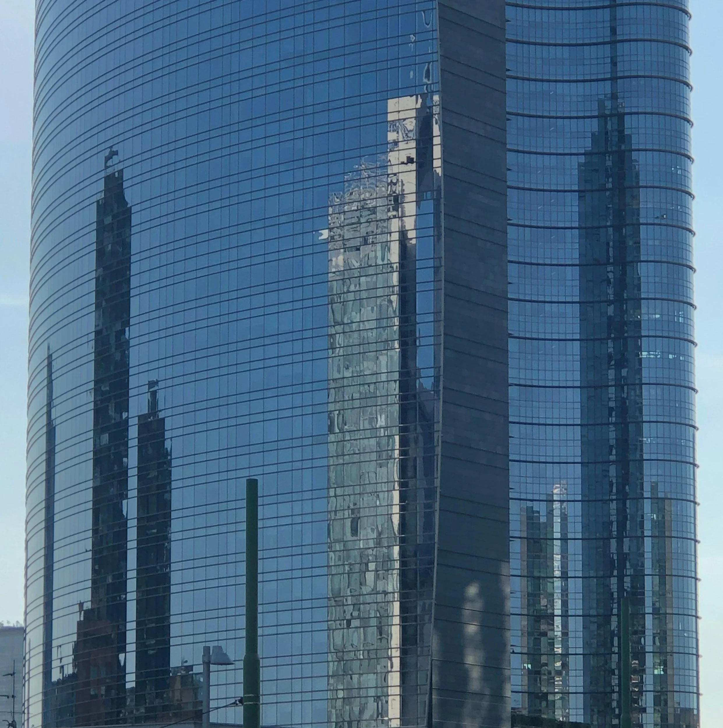 Gooool glass facade of a neighboring tall building turn into digital billboards