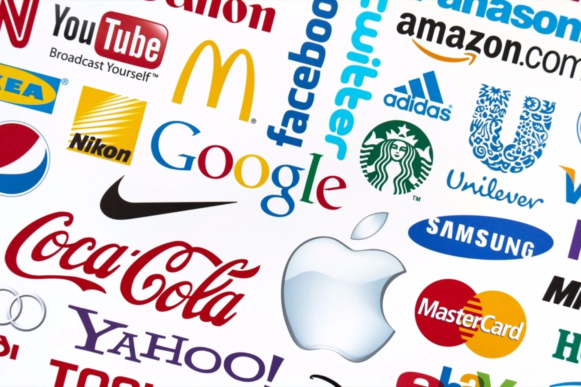 Collage of logos from popular brands including Google, Apple, Coca-Cola, Nike, McDonald's, Amazon, Adidas, Starbucks, and Samsung.