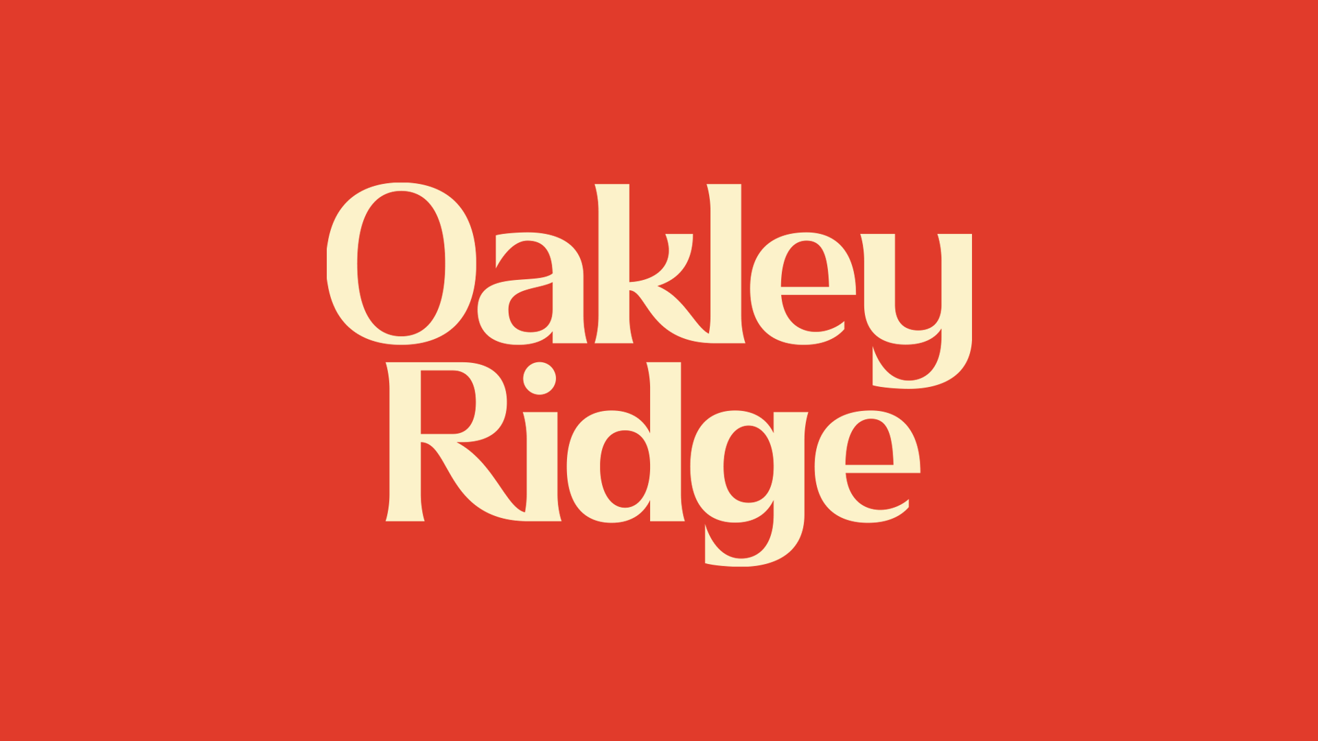 Red background with large beige text that reads "Oakley Ridge".