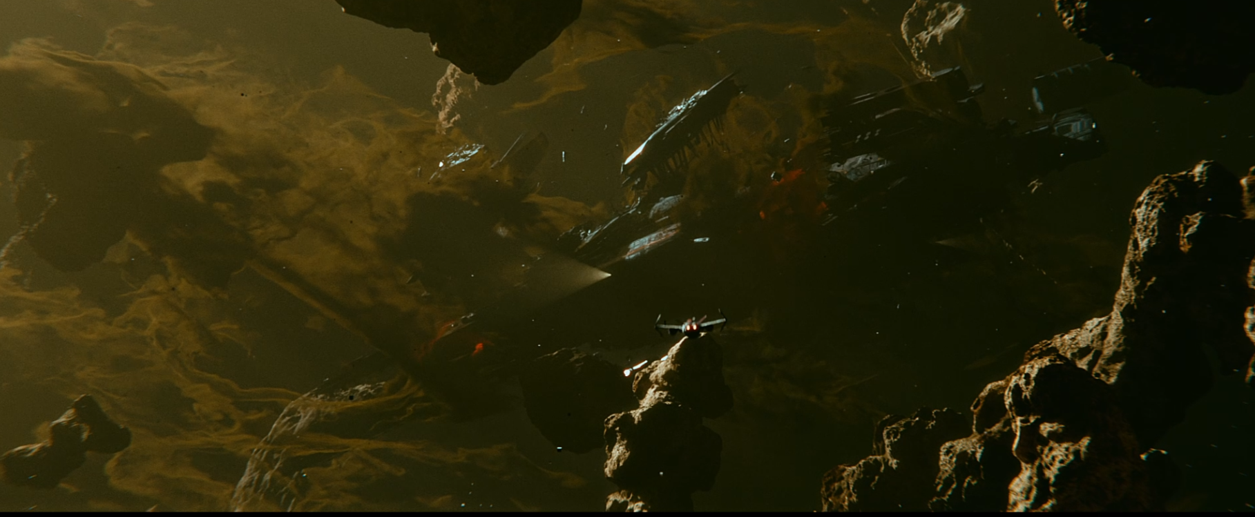 Dark underwater scene with fish swimming among rocky formations