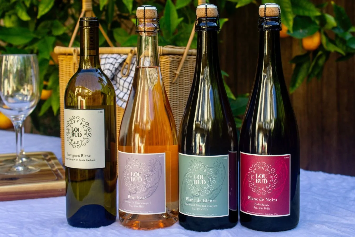 Four different wine bottles standing in a row