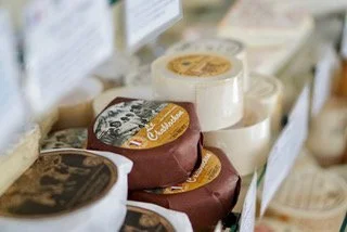 A selection of cheeses and charcuterie, olives and dried and fresh fruits