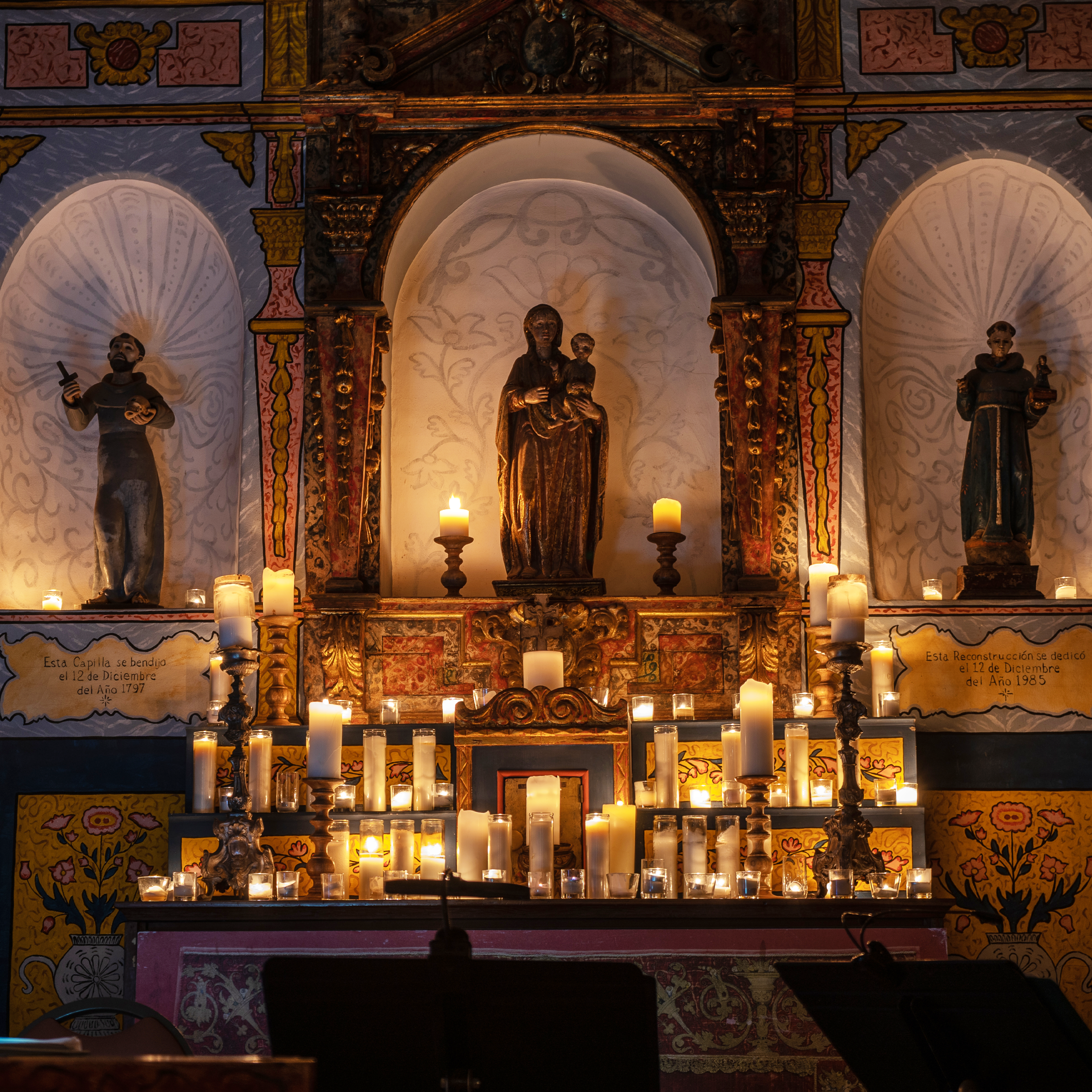Candles on an alter dedicated to the Virgin Mary