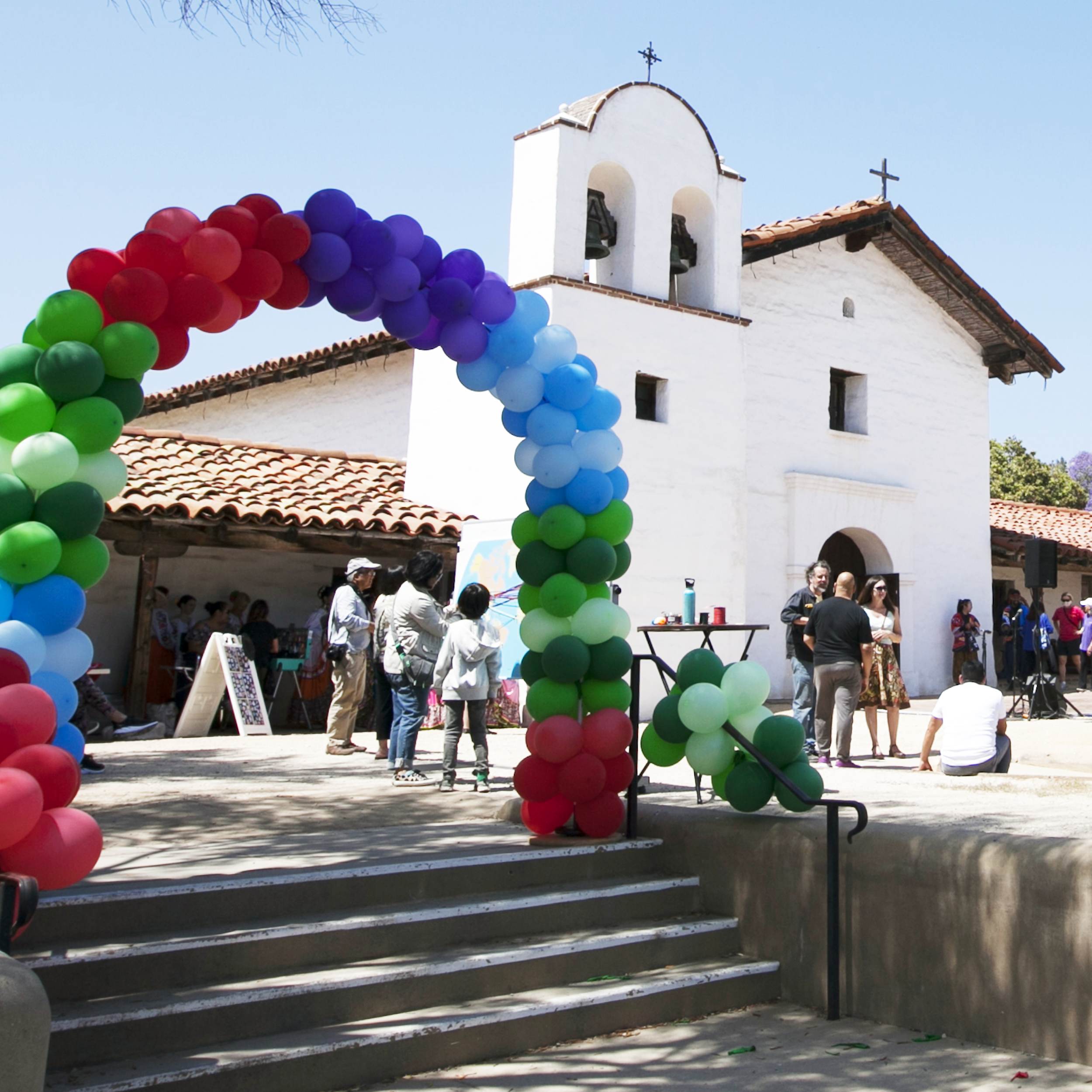 View of the chapel at the Presidio and people enjoying the event