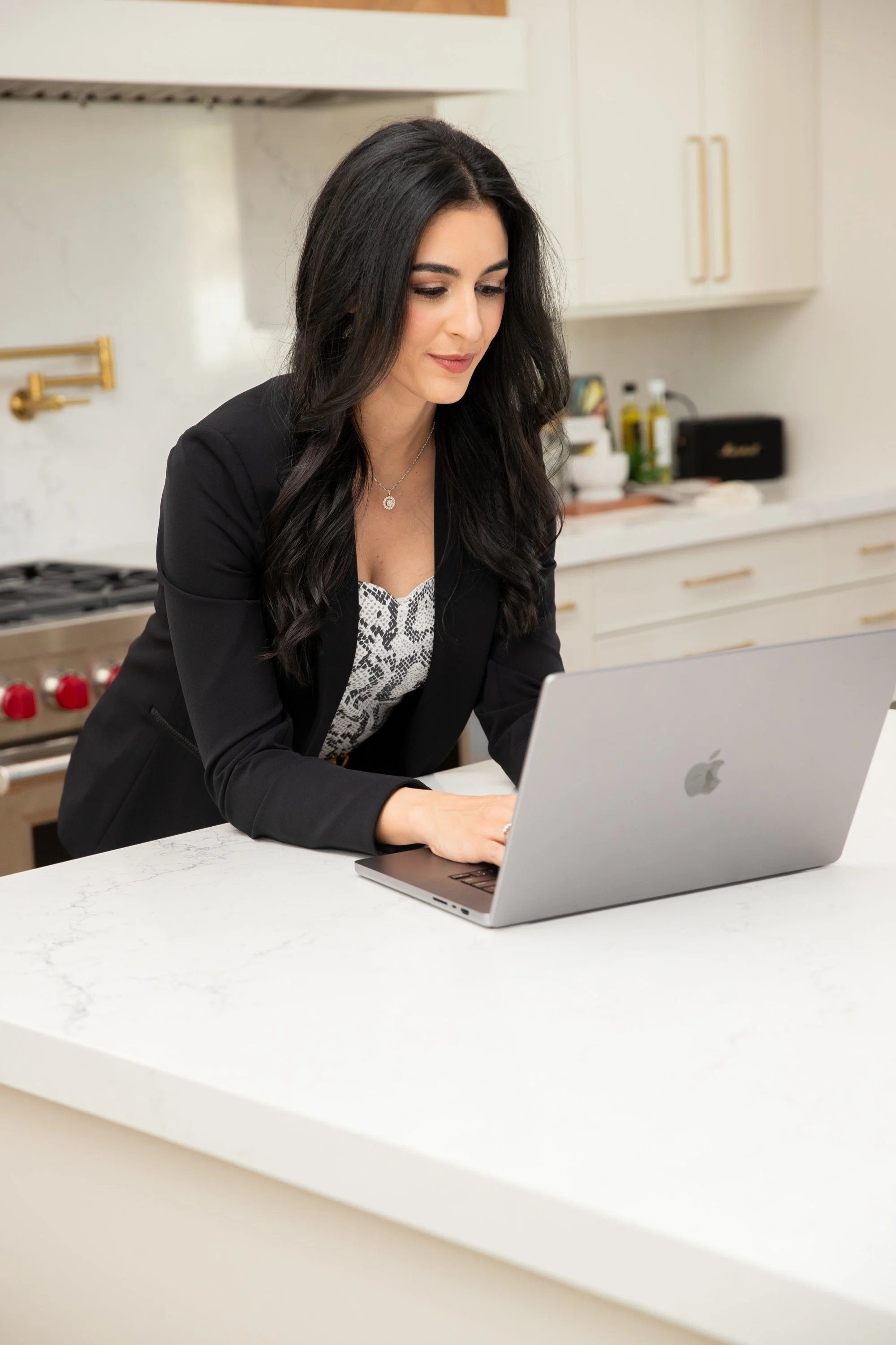 Brook Choulet, M.D. working on Laptop