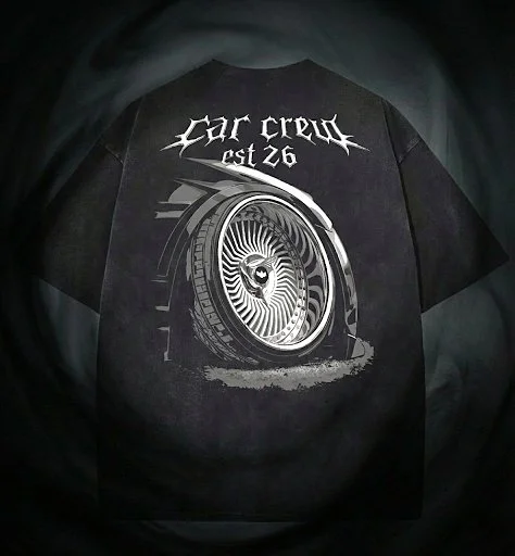 Black T-shirt with design of a spinning wheel and text 'Car crew est 26' in gothic font.