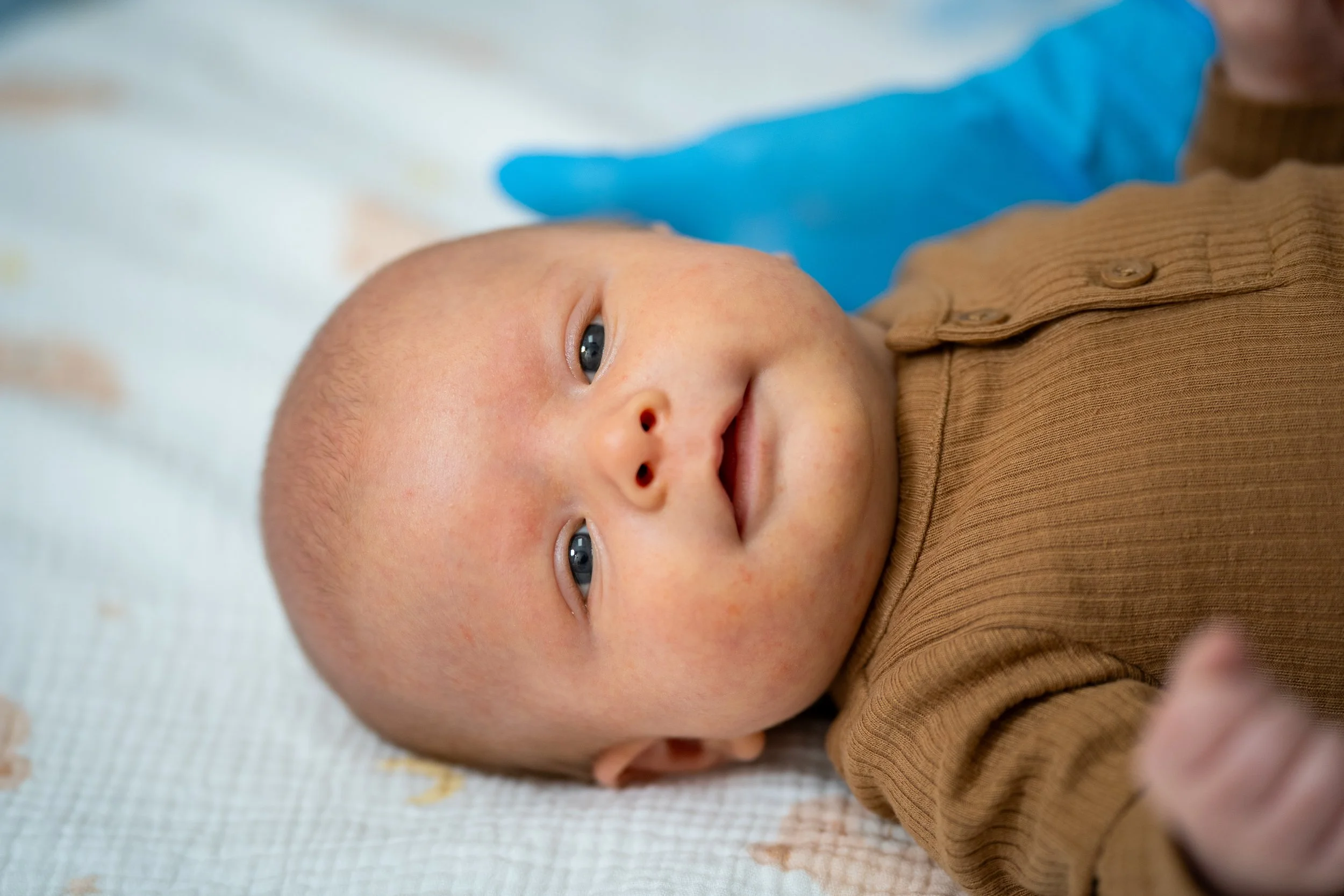 Nurse practitioner providing integrated lactation and bodywork care to mother and baby